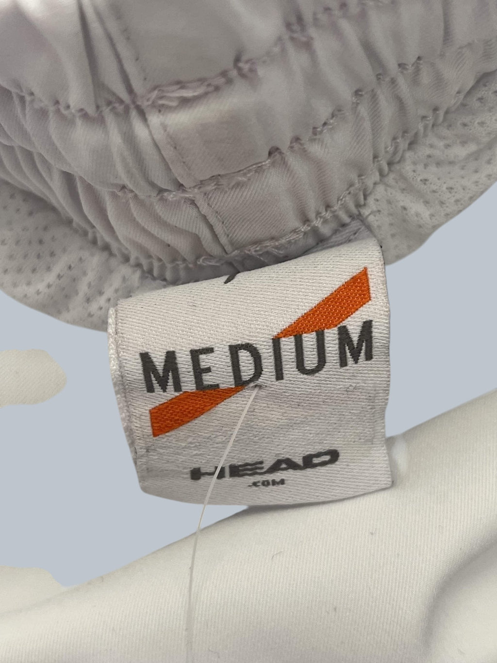 Head white tennis shorts with elastic waistband and breathable fabric, size medium.