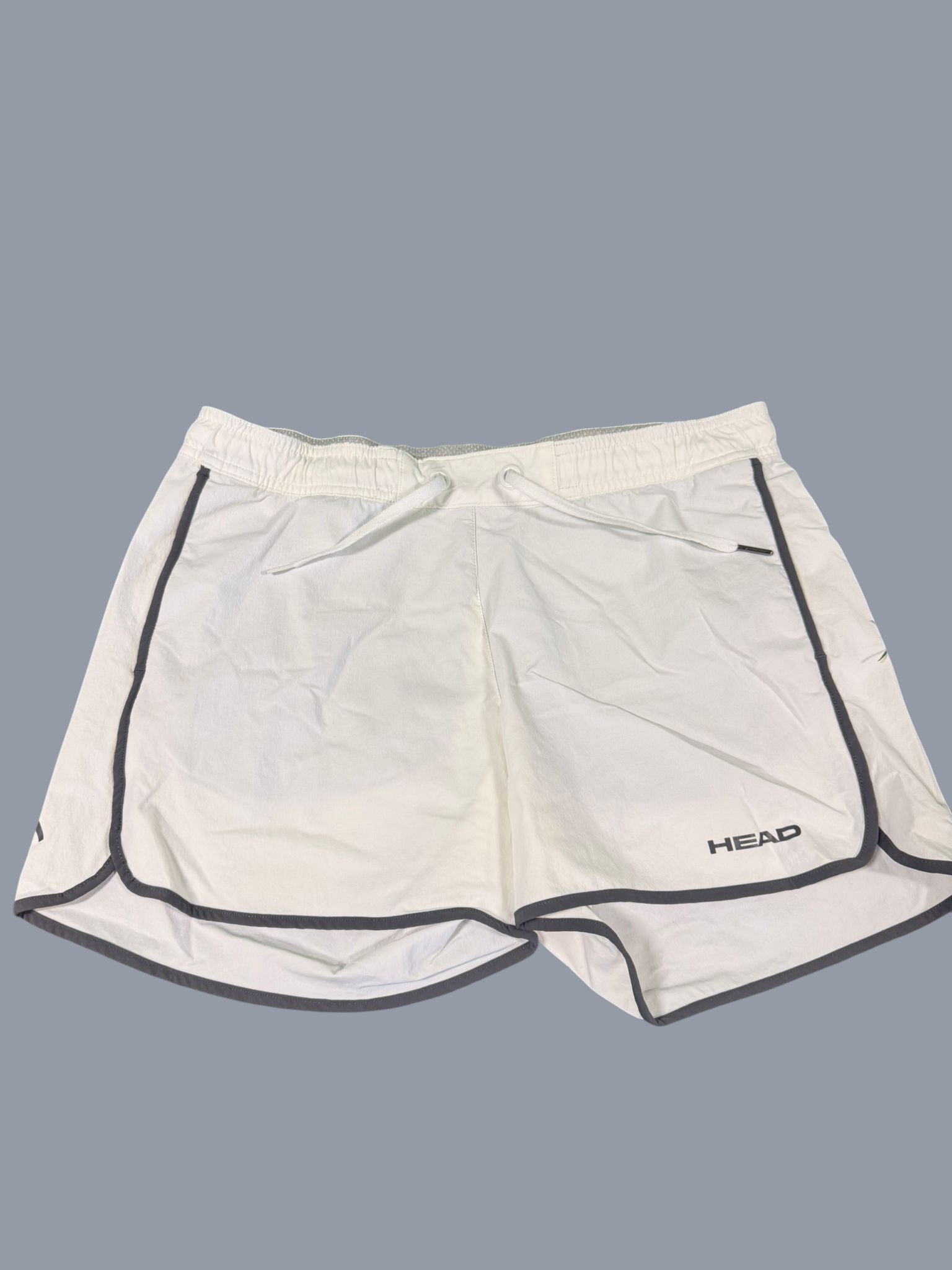 Head white tennis shorts for men with grey piping and drawstring waist. Lightweight and breathable fabric.