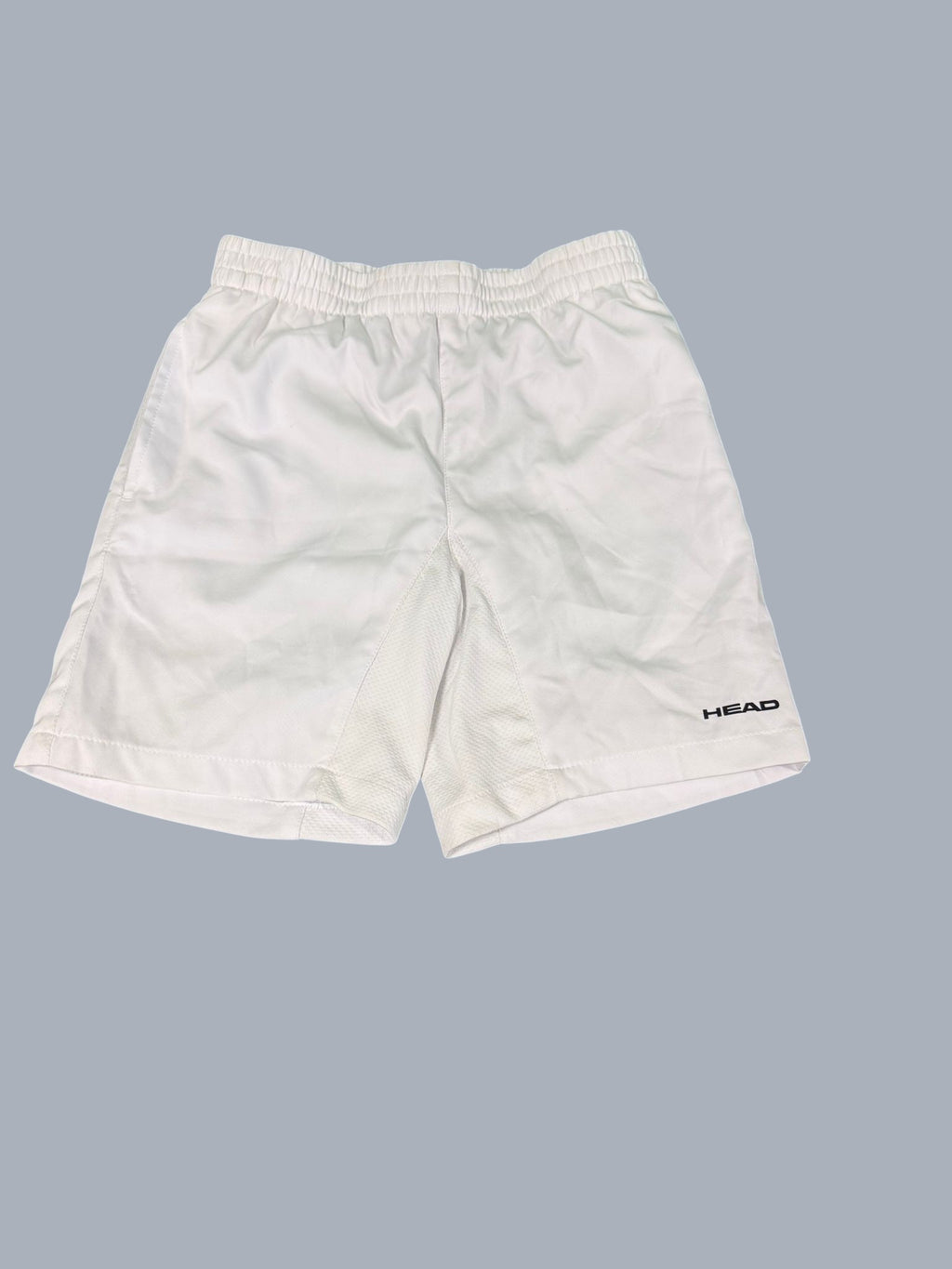 White Head tennis shorts with elastic waistband and mesh thigh inserts, size Large.