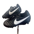 Pair of black Nike football boots with white Swoosh on display