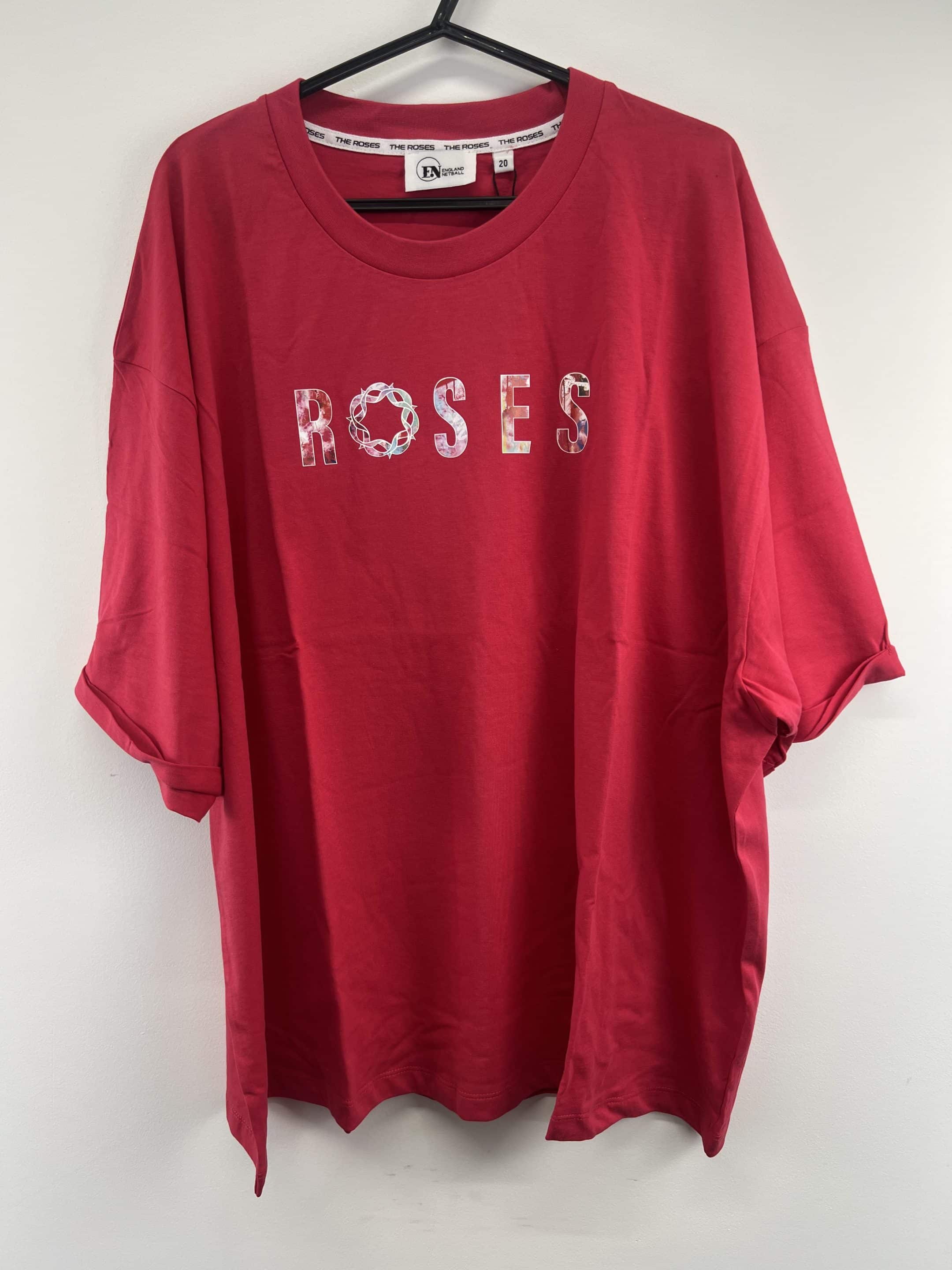 Front view of pink England Netball Roses graphic T-shirt on hanger