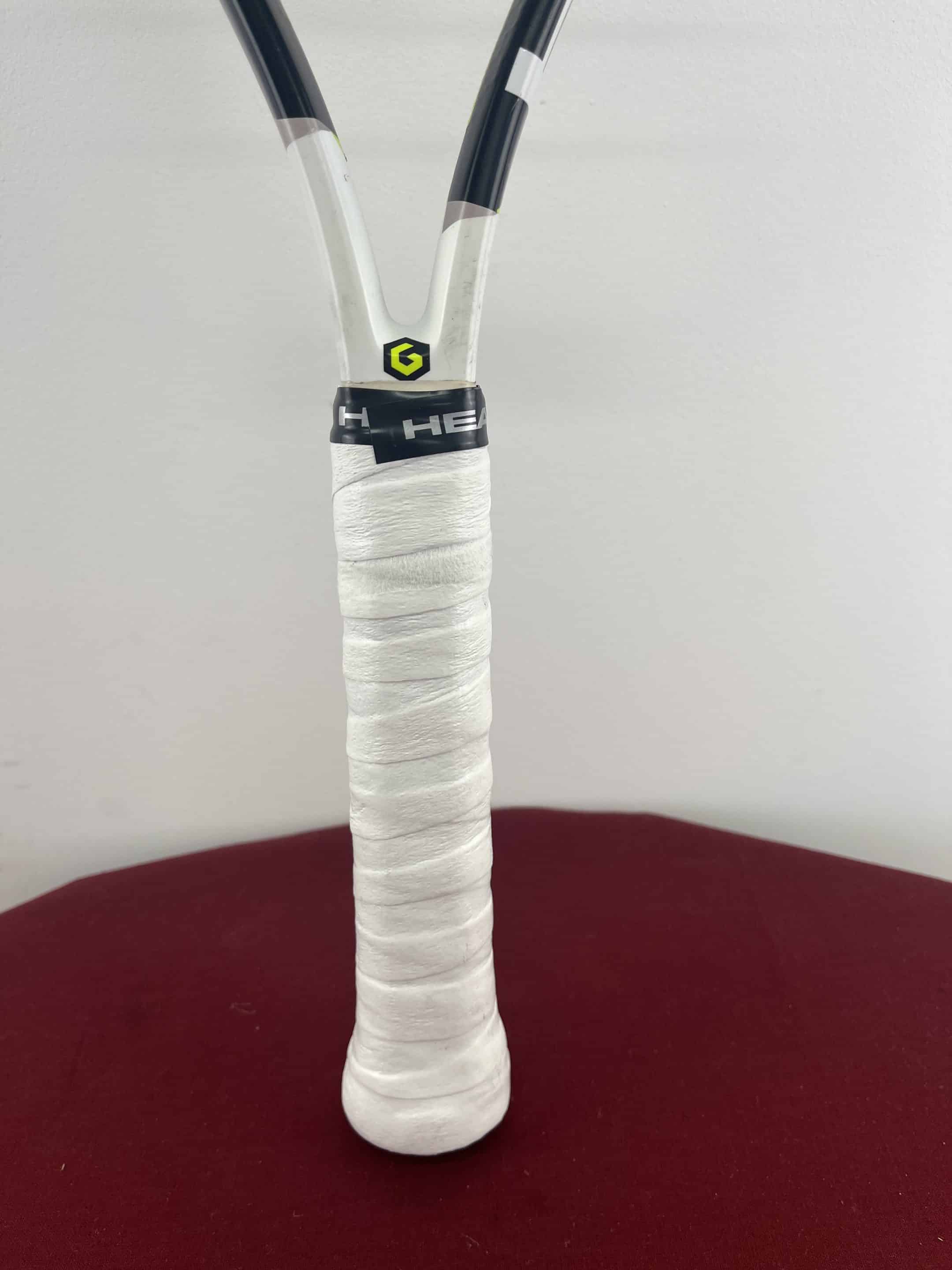 Close-up of HEAD Speed JR Tennis Racquet handle with white grip