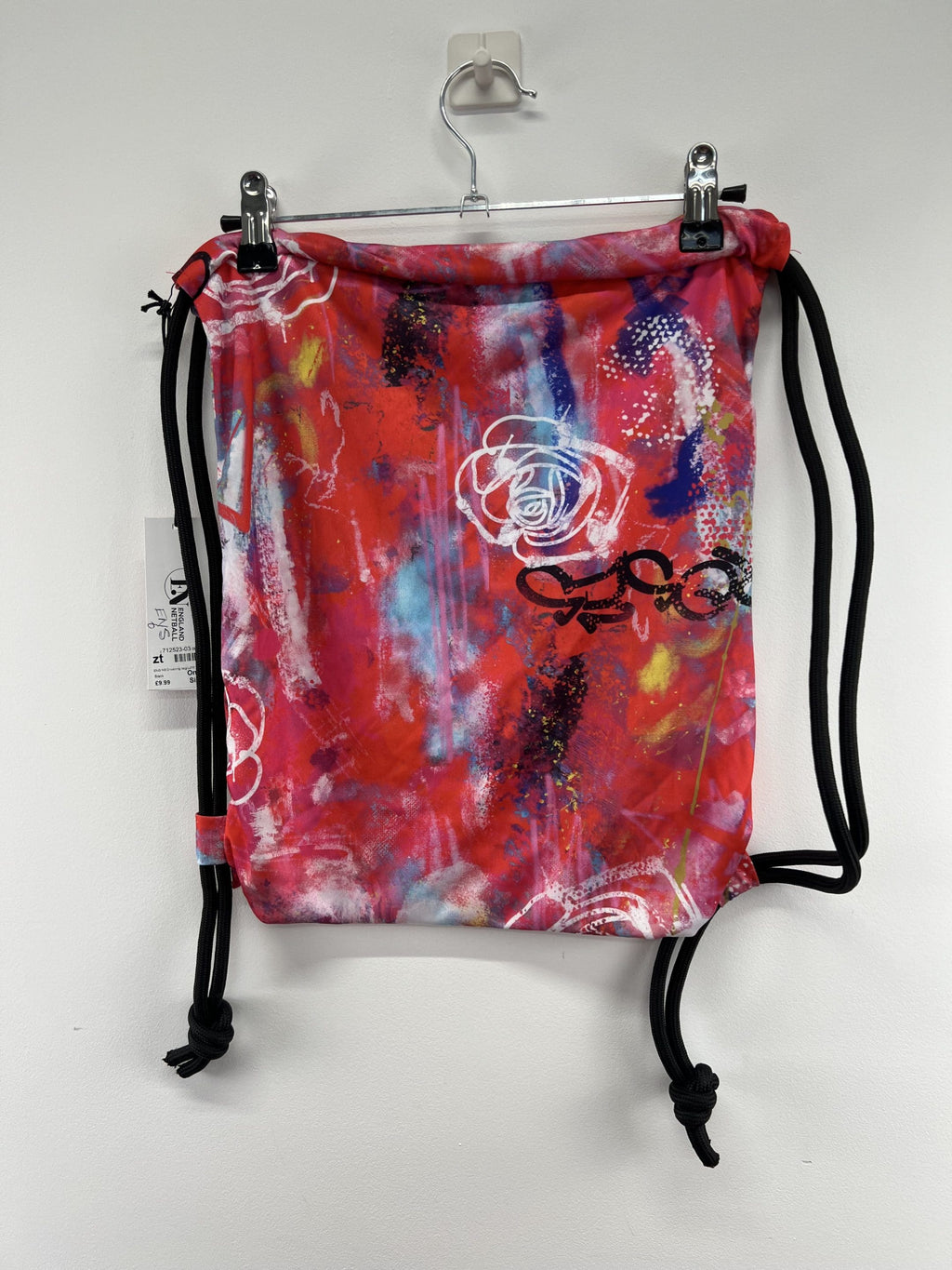 Back view of England Netball Graffiti Roses drawstring sports bag featuring bold rose graphics