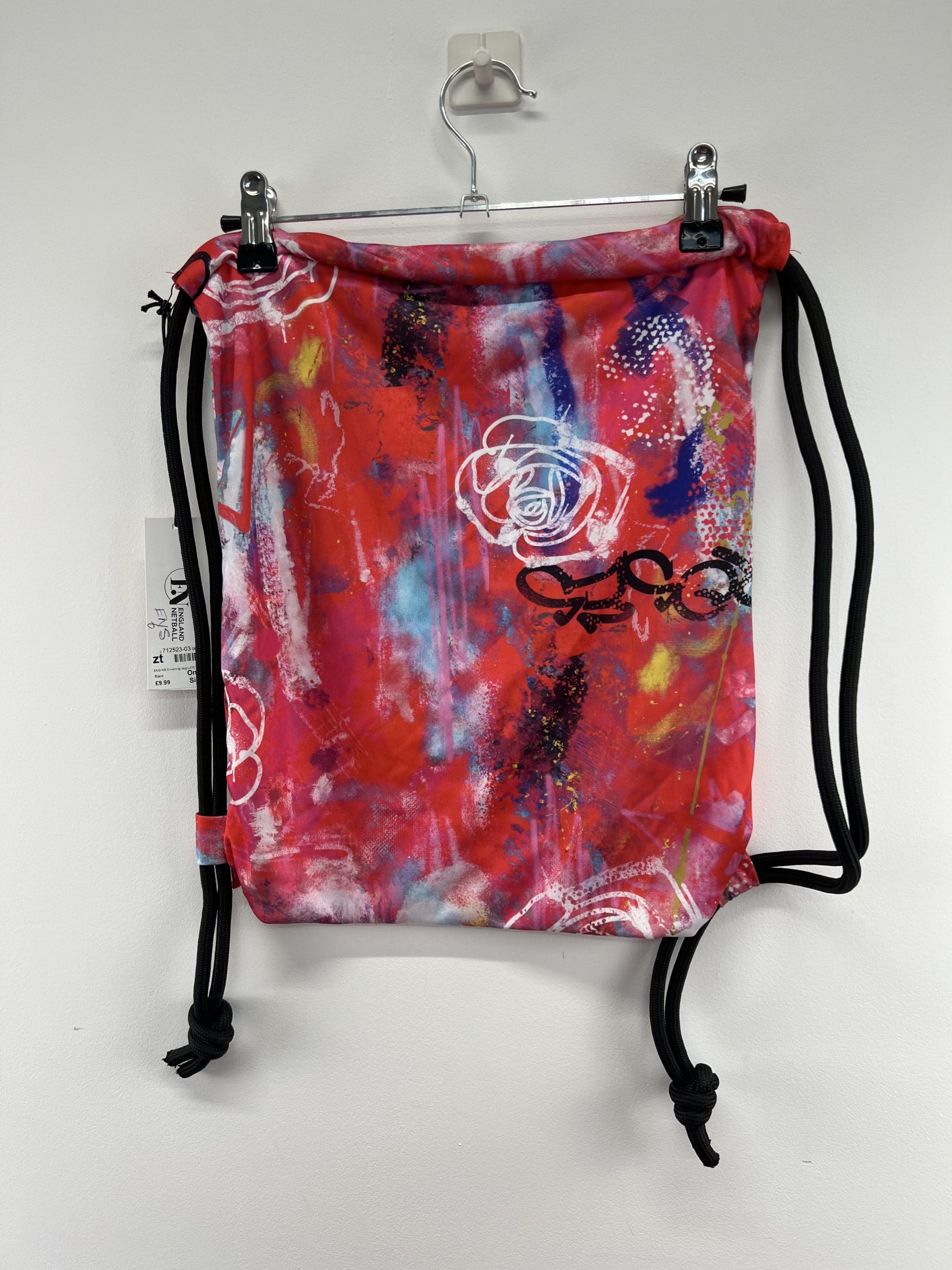 Back view of England Netball Graffiti Roses drawstring sports bag featuring bold rose graphics