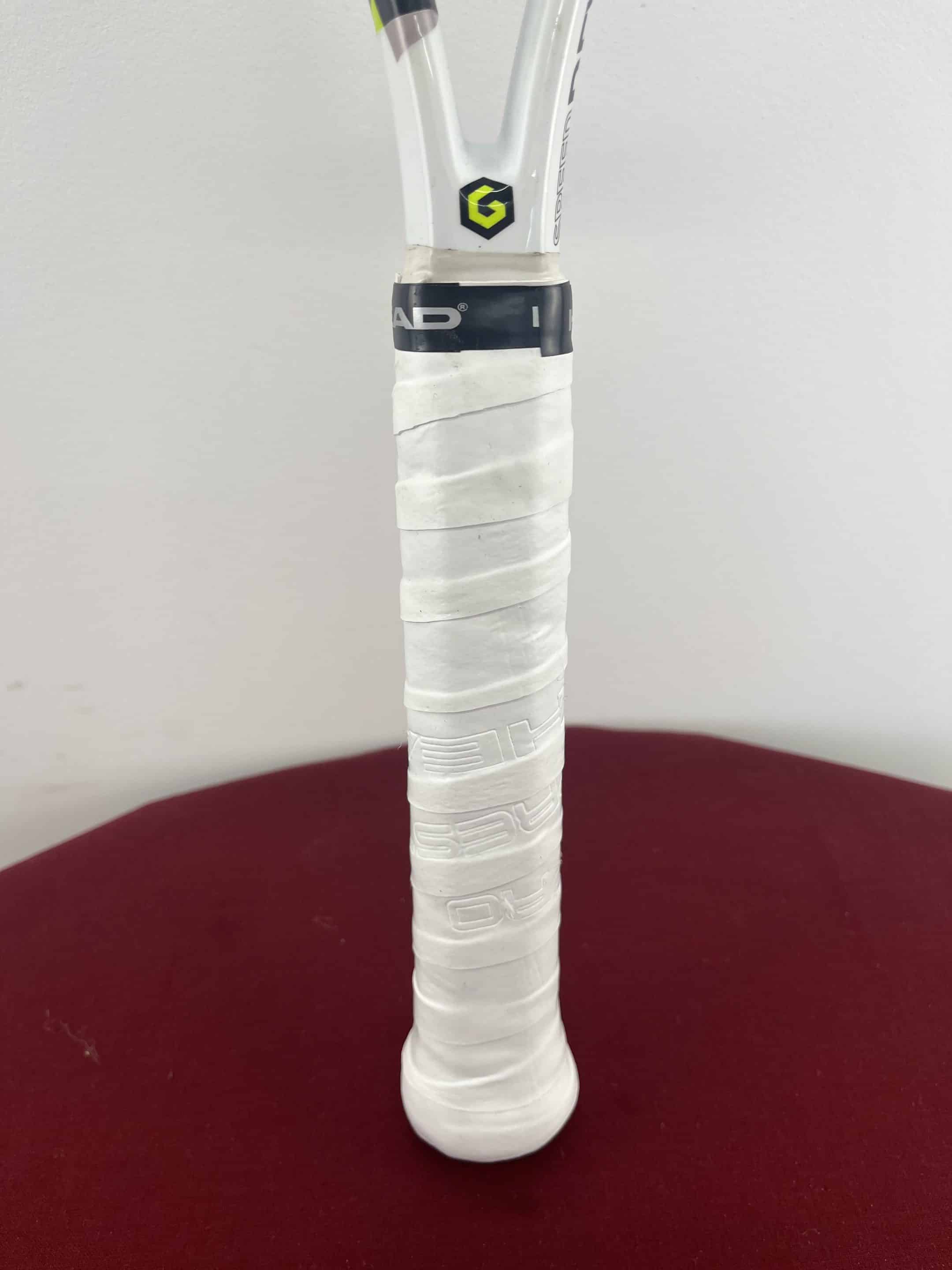 Close-up of white grip and Handle of Head Speed Rev Pro Tennis Racquet