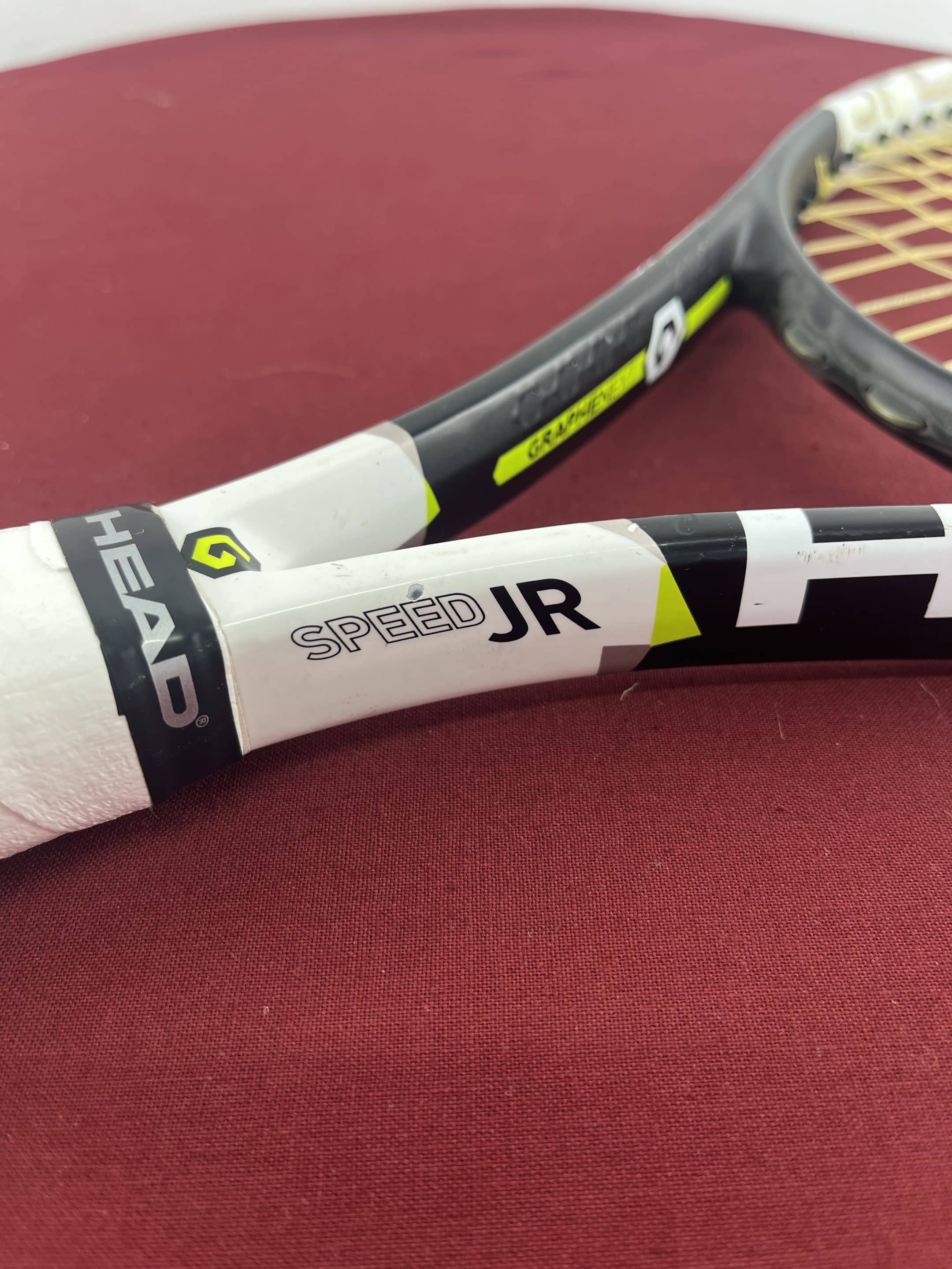 Detail of HEAD Speed JR and HEAD branding on the racquet throat