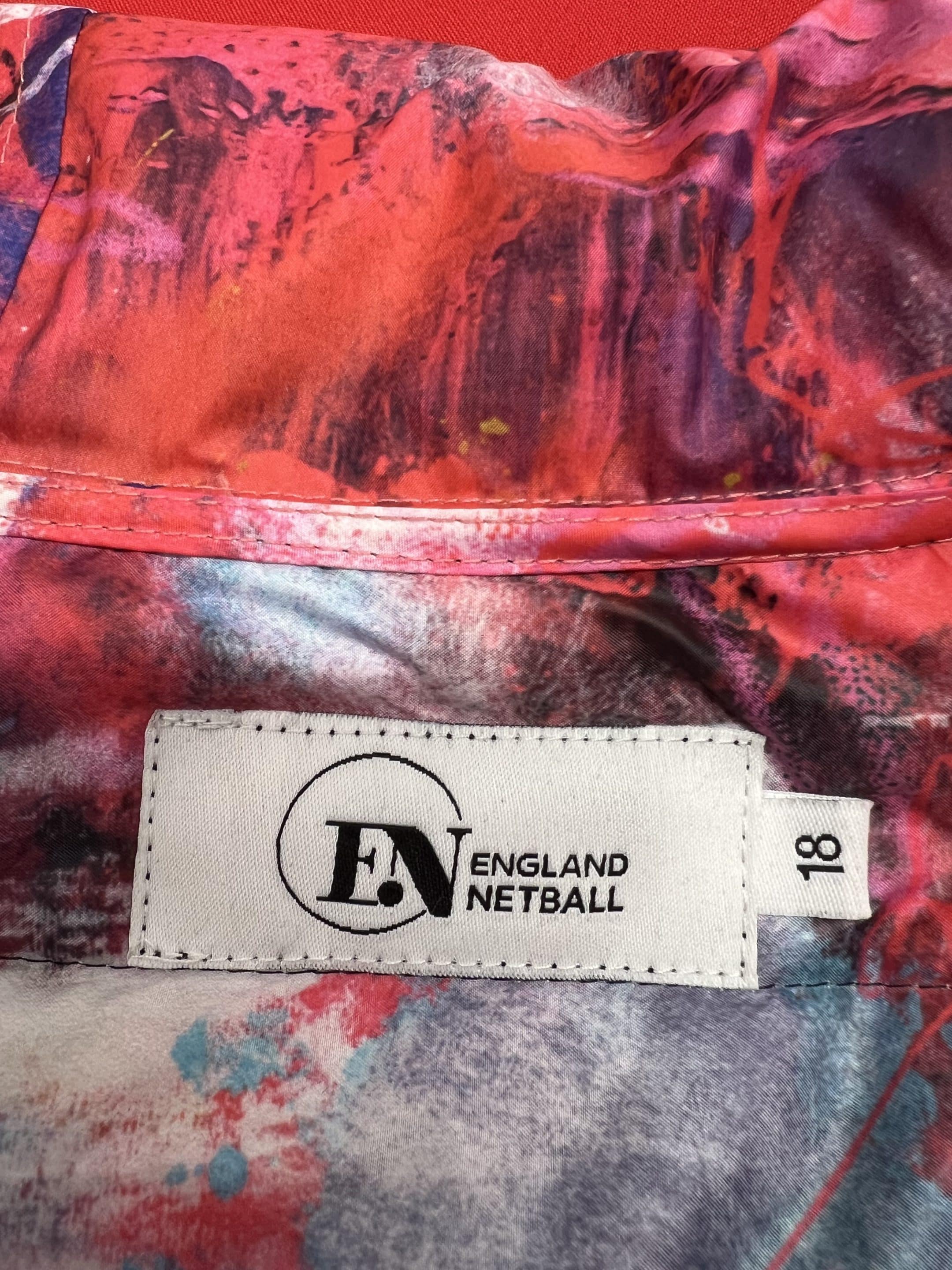 Close-up of England Netball label and colourful graffiti-print inner lining