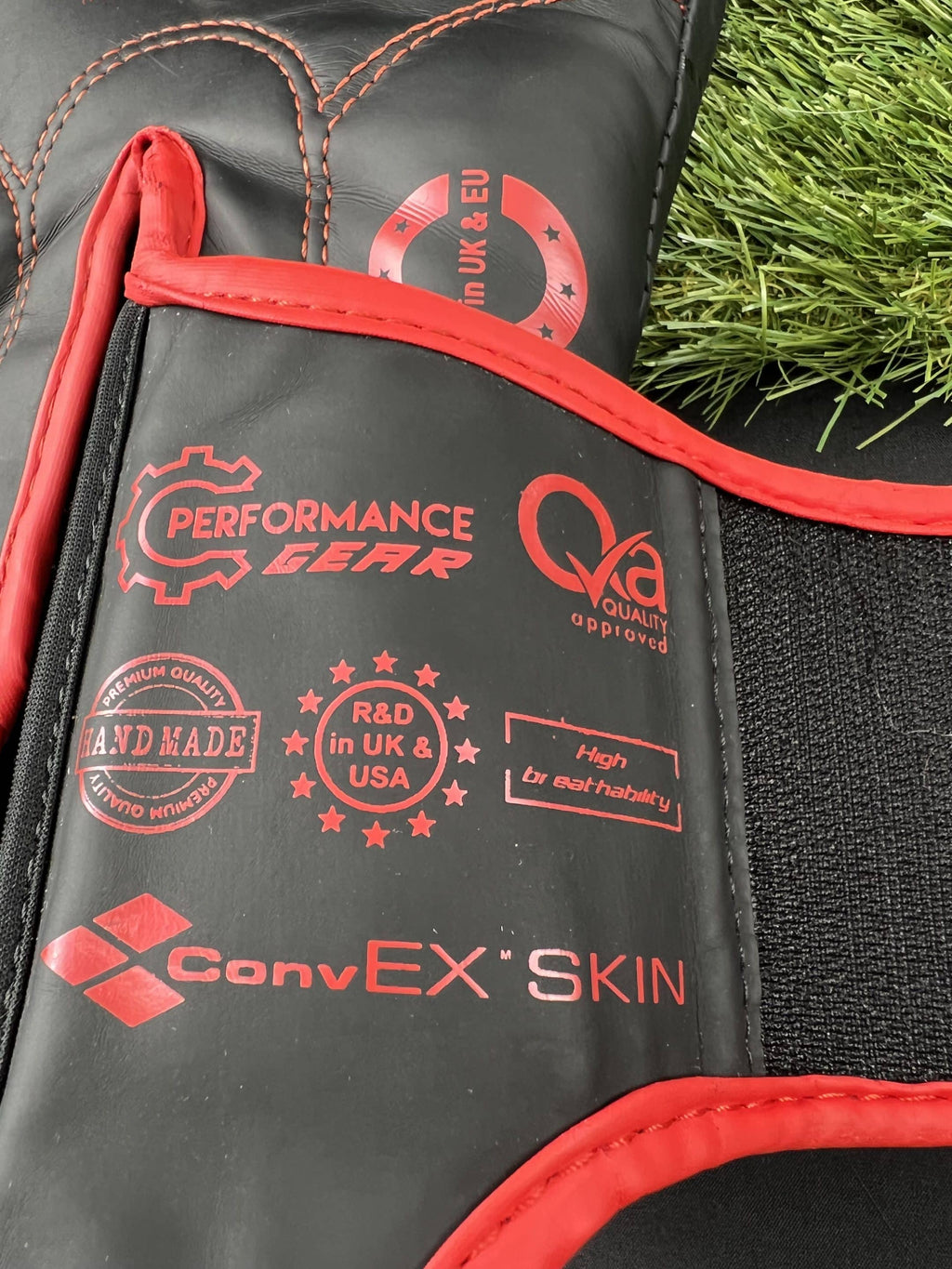 Close-up of RDX boxing gloves detailing ConvEX Skin and handmade quality badges