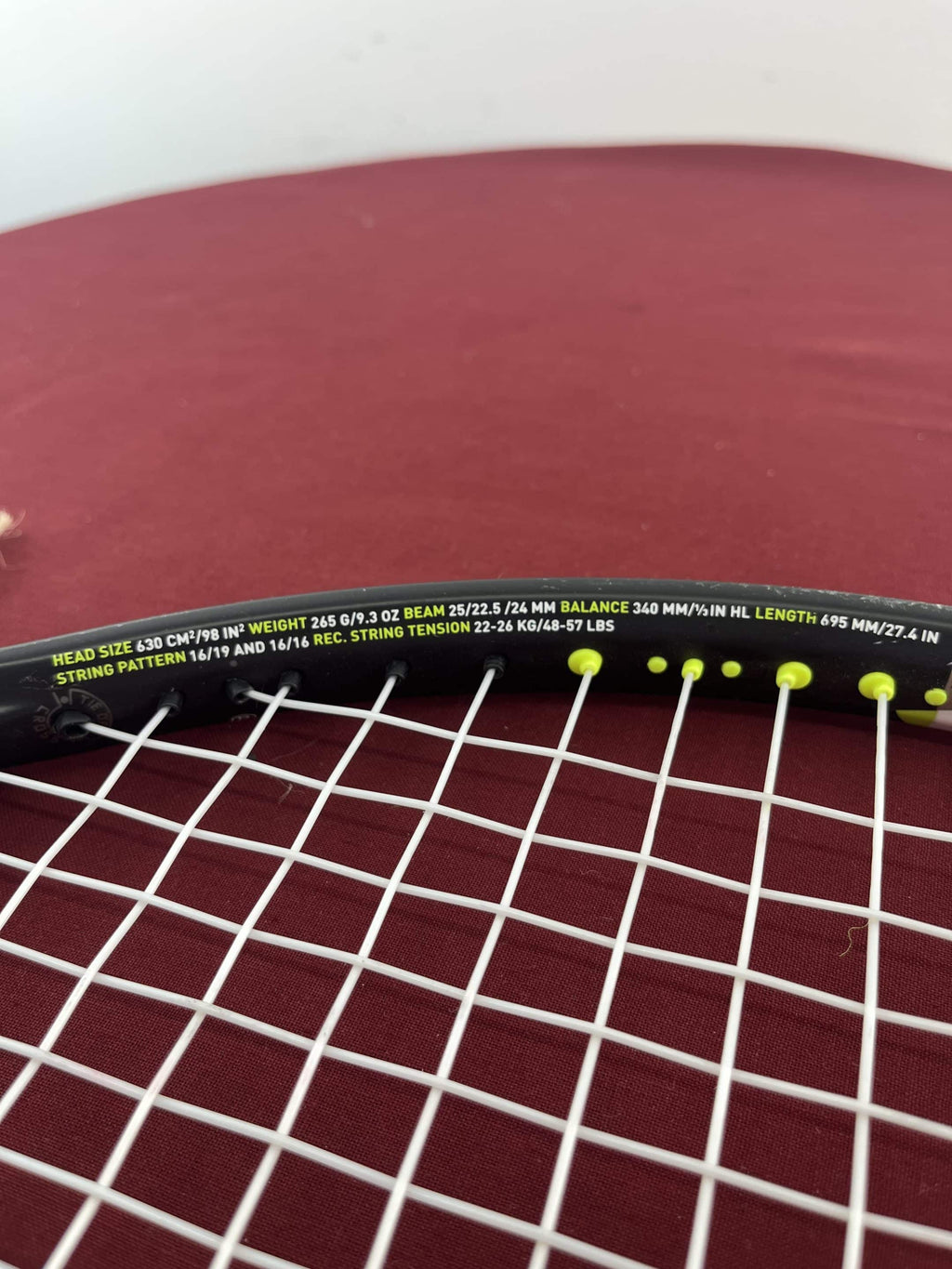Close-up of racquet specifications and string bed on Head Speed Rev Pro Tennis Racquet
