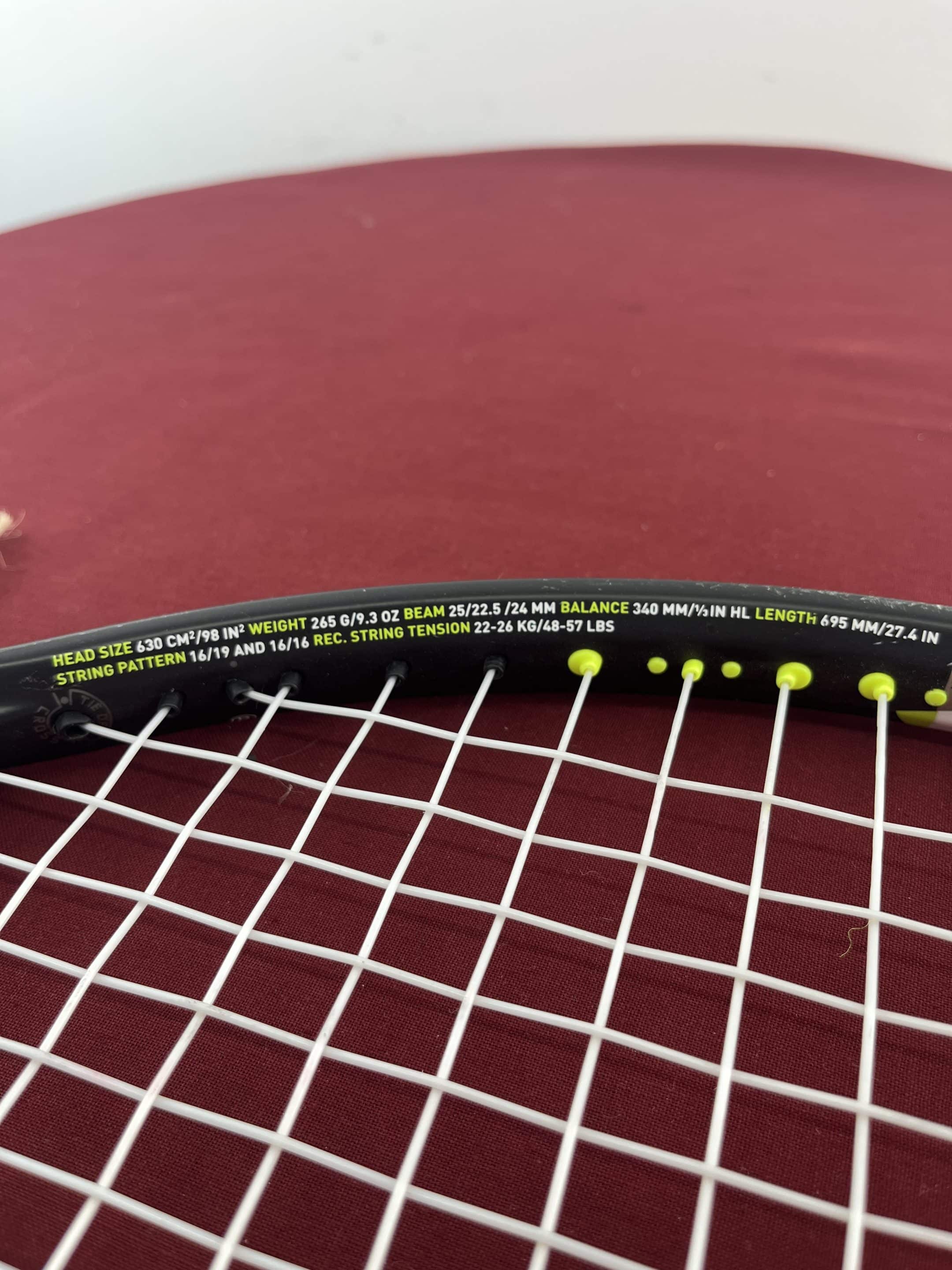 Close-up of racquet specifications and string bed on Head Speed Rev Pro Tennis Racquet
