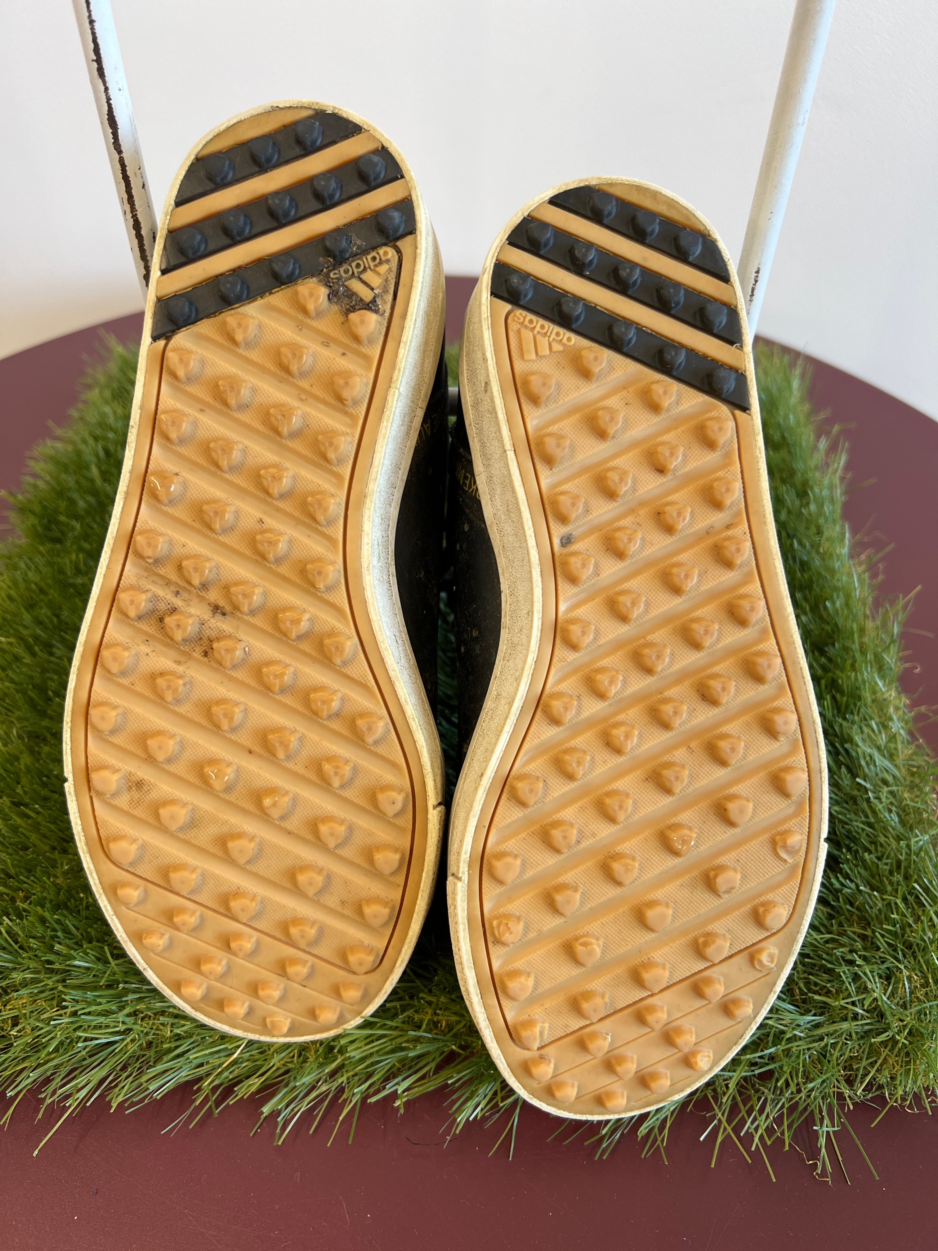 Underside view of kids adidas Astro Boots showing studded rubber soles for astro turf grip