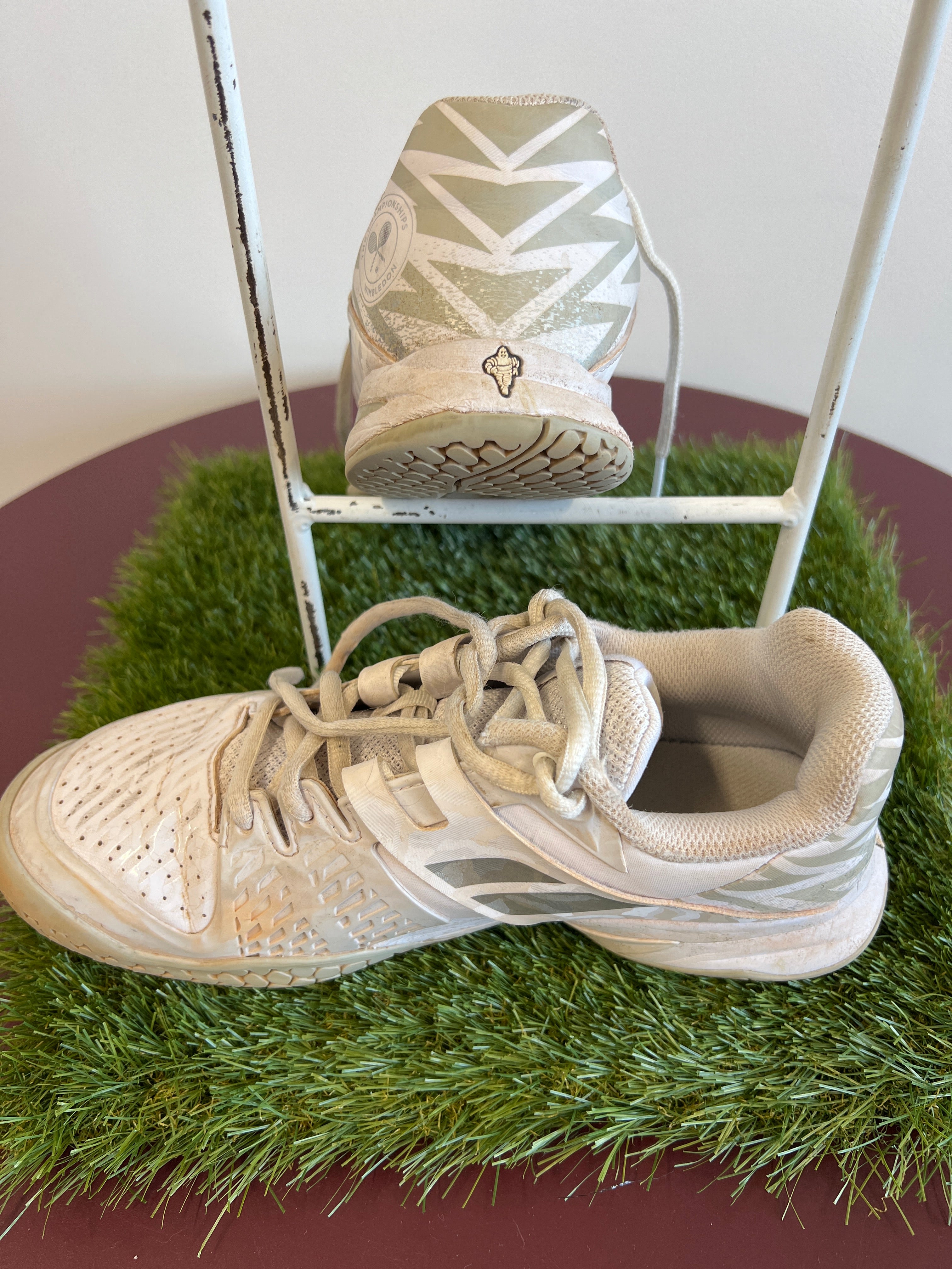 Side and rear view of Babolat Propulse Junior tennis shoes showing padded collar and Wimbledon logo detail