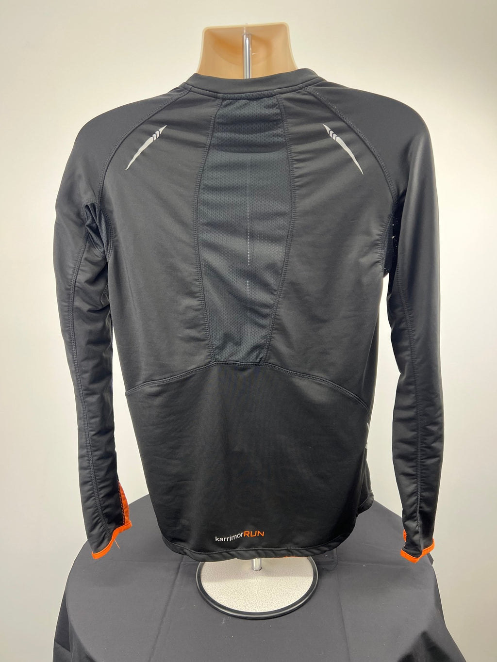 Back view of Karrimor X-Lite long sleeve black and orange running top with visible branding