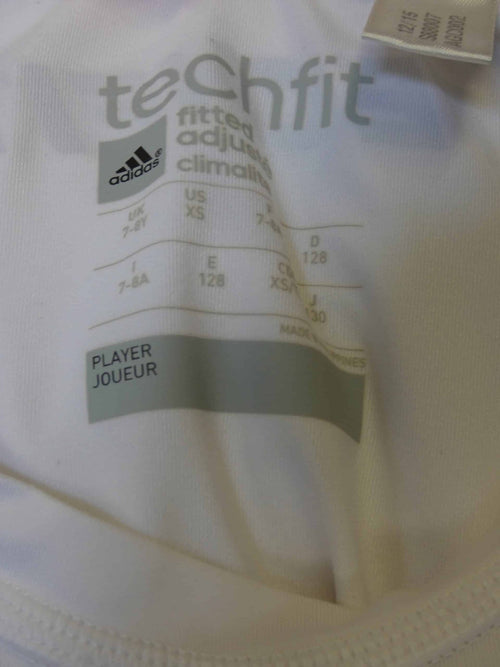 adidas Techfit size and care label showing XS