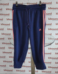 Front view of navy blue adidas kids joggers with pink stripes and drawstring hanging on rail