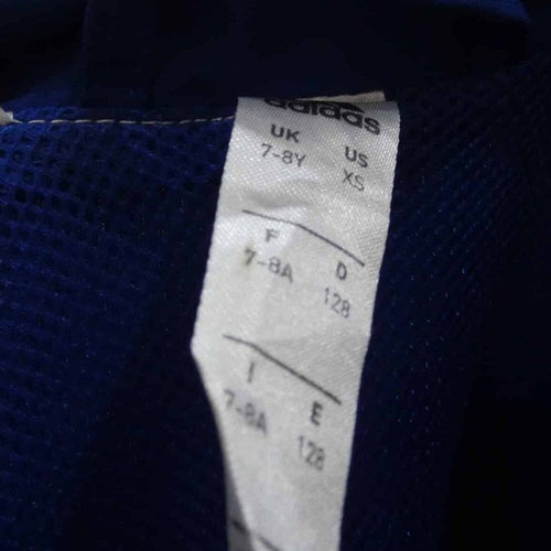 Inside garment label showing adidas branding and size 7-8Y/XS