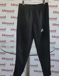 adidas Tiro17 kids black tracksuit bottoms with white logo and ankle zips, hanging on display