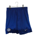 Nike Chelsea blue football shorts with club crest and Dri-FIT technology displayed on a hanger