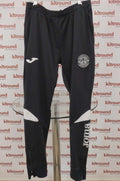 Front view of Joma Hibernian black tracksuit bottoms with club crest and branding