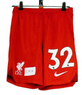 Front view of red Kids Liverpool FC football shorts with No. 32 and Nike logo