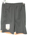 Front view of black Southampton FC kids football shorts with club crest on leg