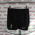 Front view of black Tottenham Hotspur Nike kids football shorts with official logos