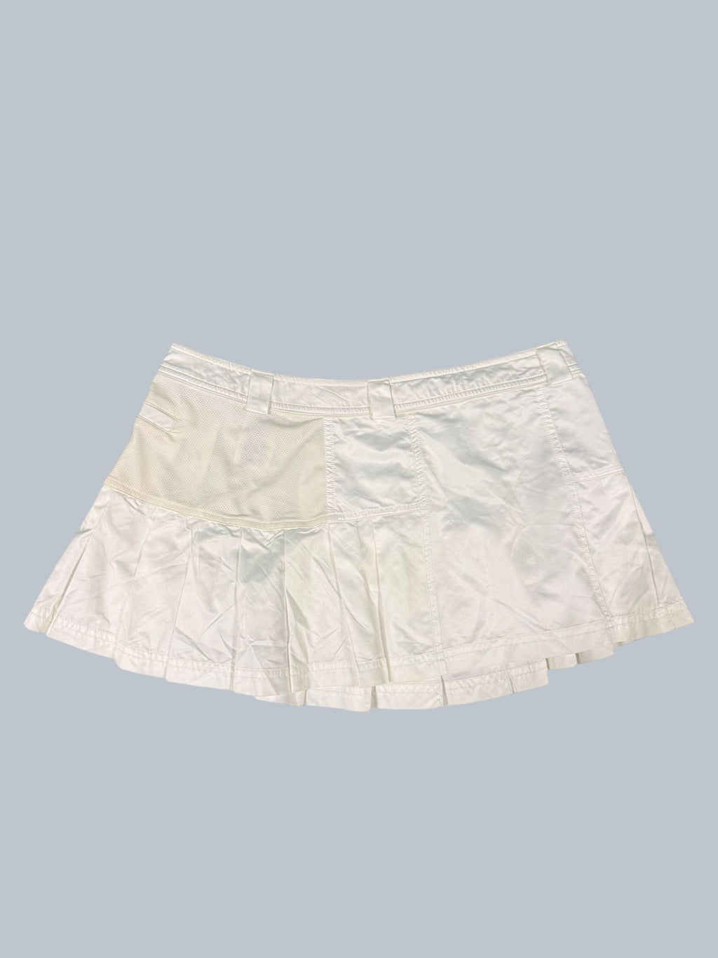 Adidas Stella McCartney white tennis skirt with pleated hem and mesh panel detail. Size 12.