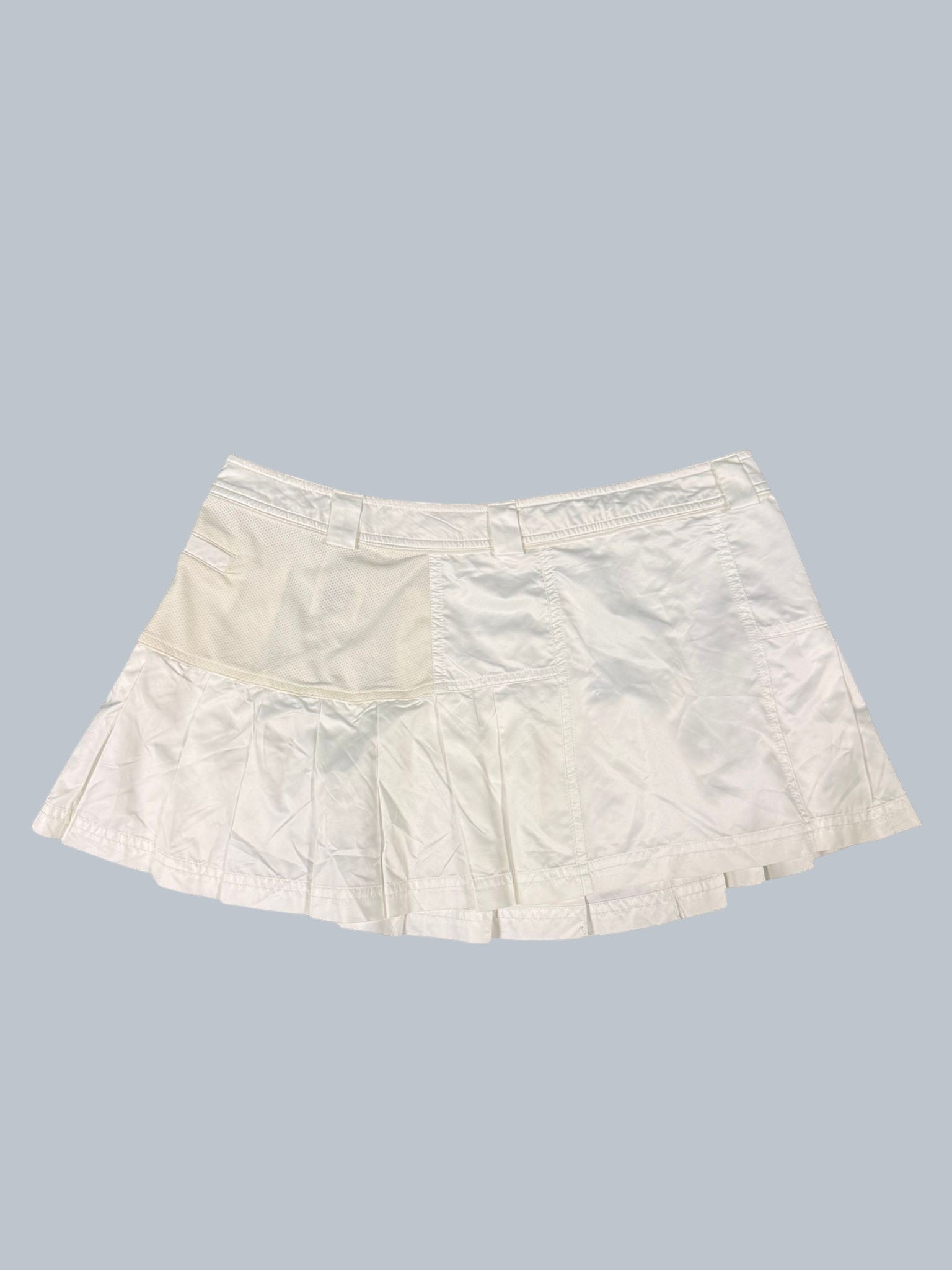 Adidas Stella McCartney white tennis skirt with pleated hem and mesh panel detail. Size 12.