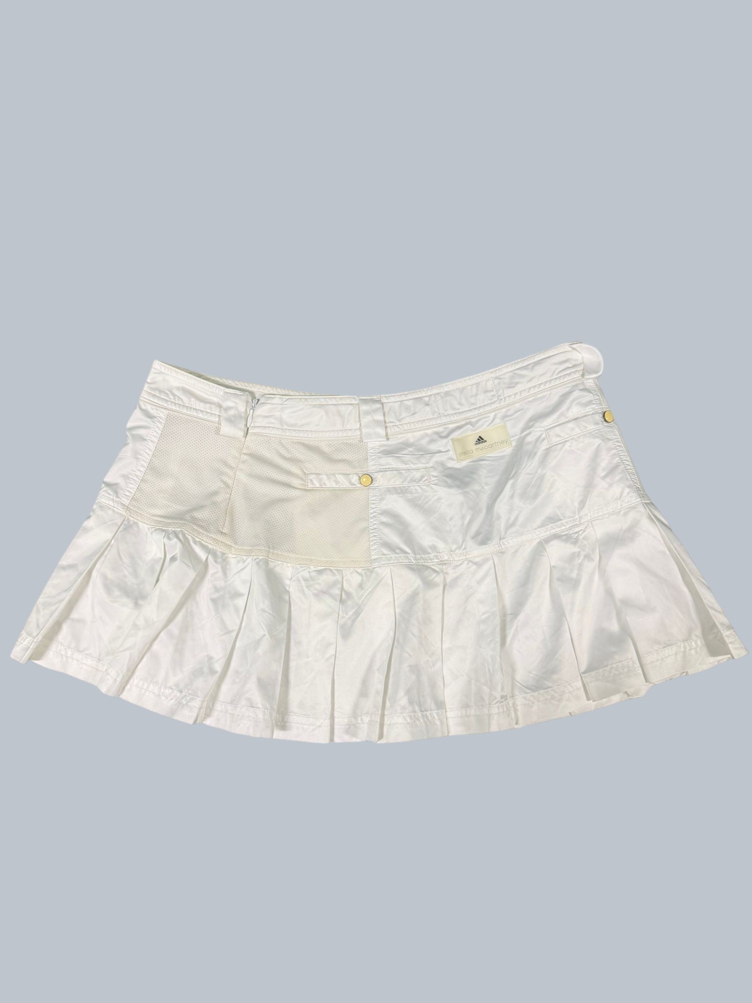 Adidas Stella McCartney white tennis skirt with pleated hem and mesh panels. Size 12.