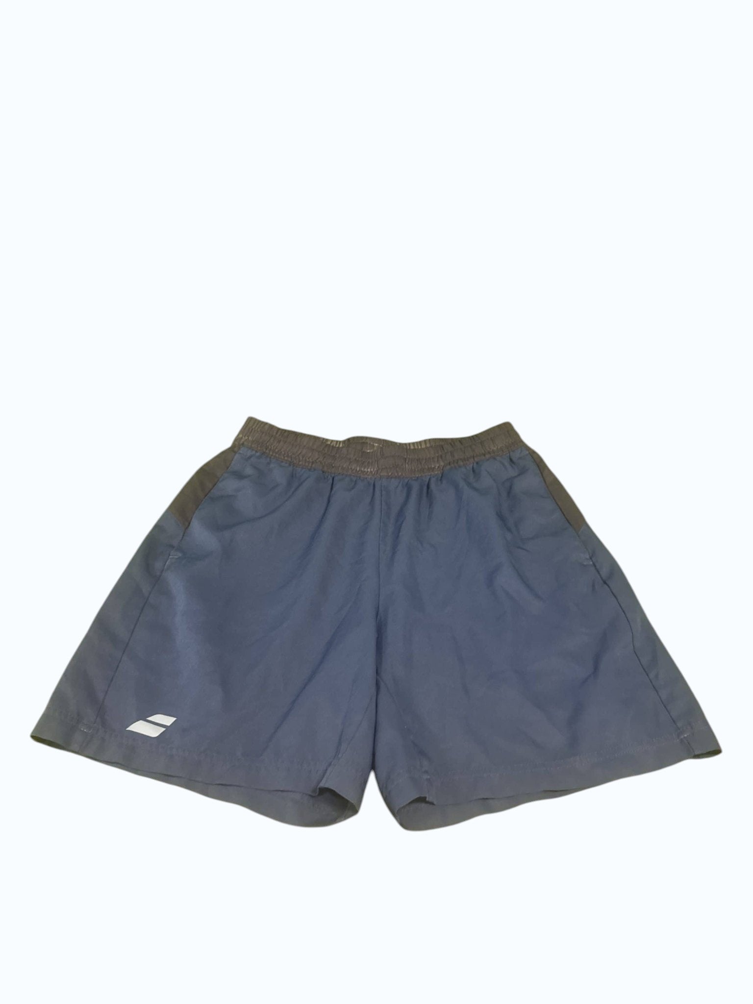 Babolat blue tennis shorts with elastic waistband and grey accents. Lightweight, breathable fabric for comfort and flexibility.