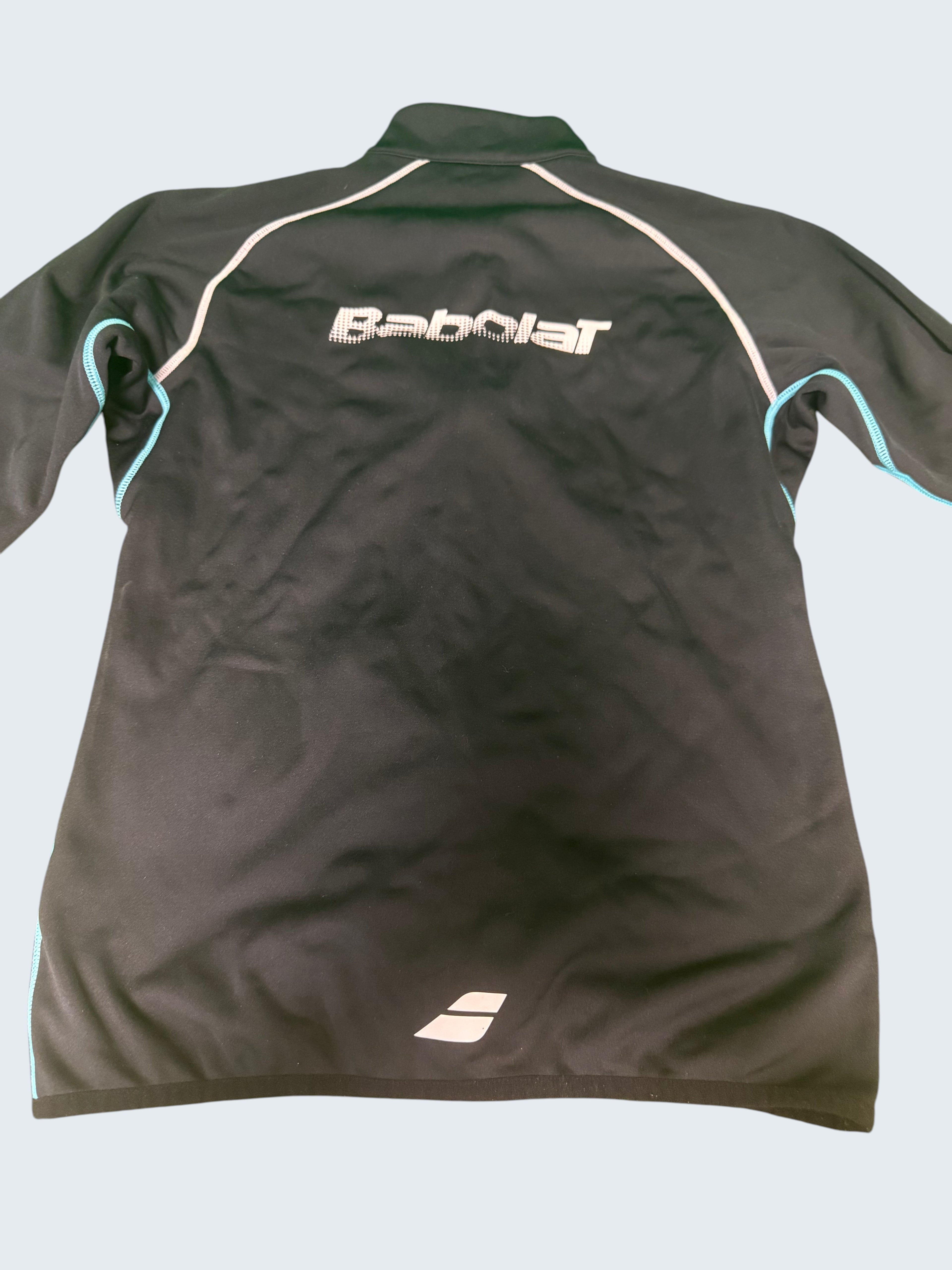 Black Babolat jacket with white and light blue trim. Features a full zip and the Babolat logo on the back.
