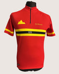 kitround De Marchi red cycling jersey with yellow and black stripes, half-zip front, and mountain logo.
