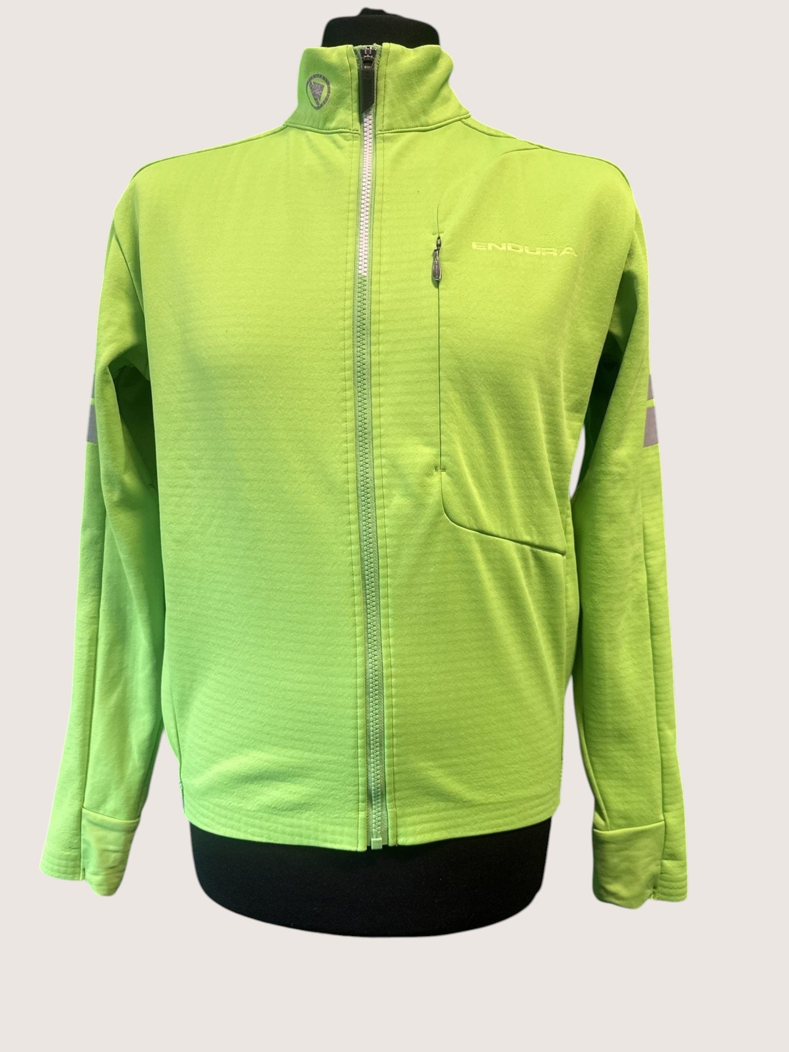 Endura vibrant green lightweight cycling jacket with full zip, high collar, chest pocket, and reflective accents.