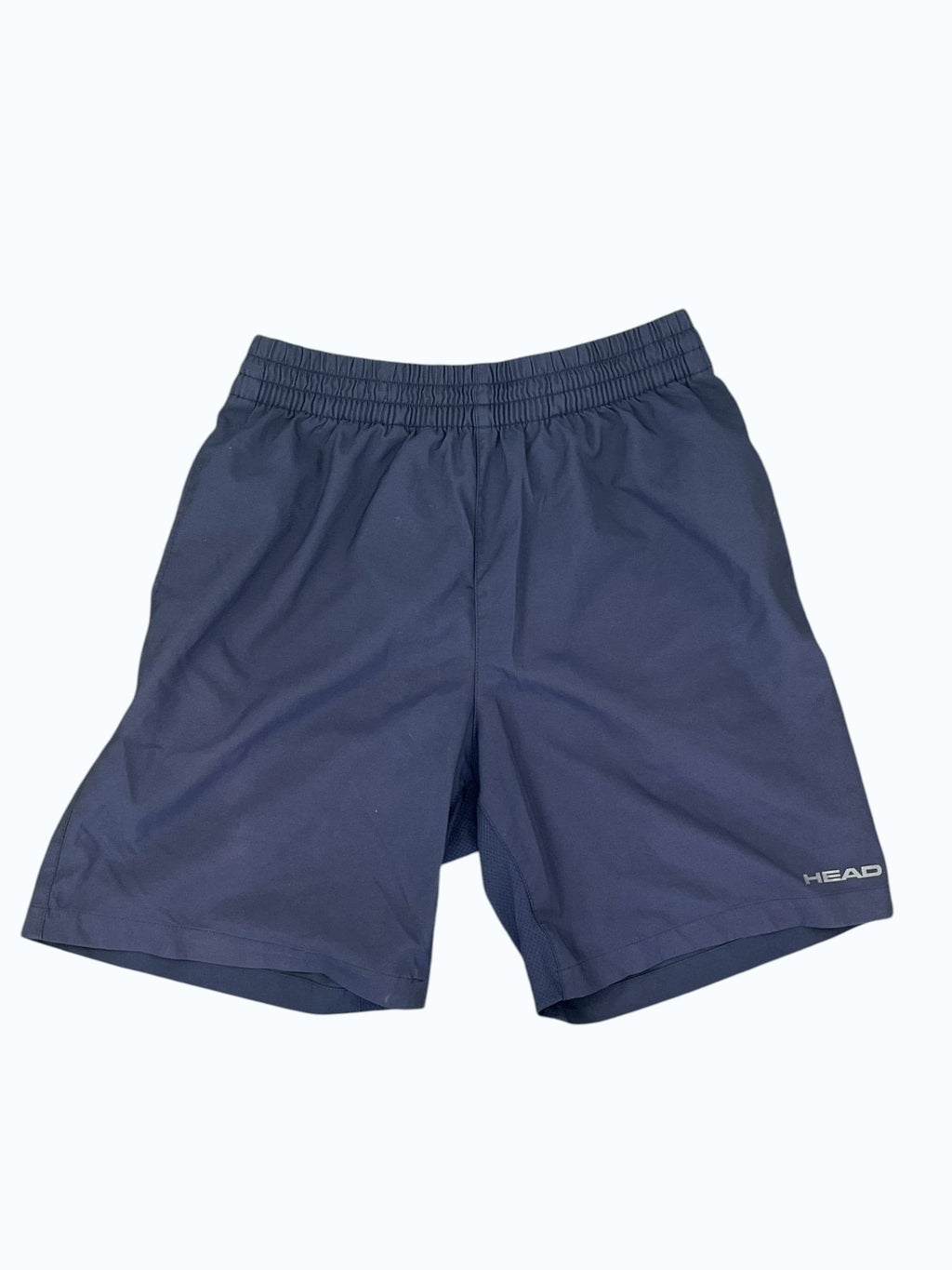 Dark blue HEAD men's tennis shorts with elastic waistband and subtle logo detail. Ideal for athletic performance.