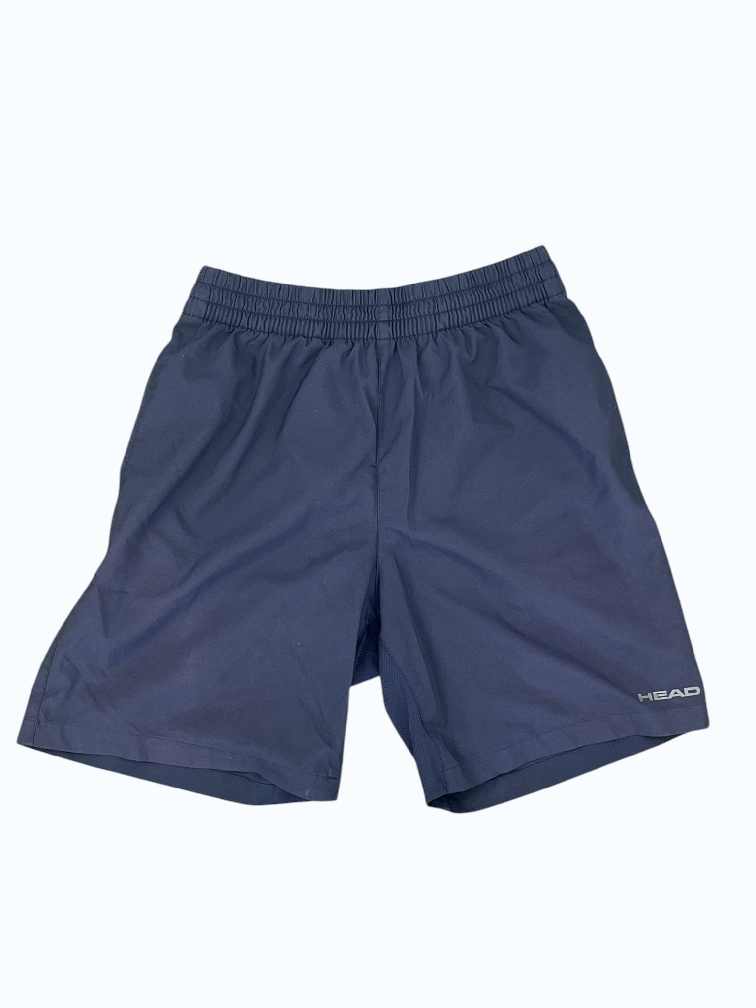 Dark blue HEAD men's tennis shorts with elastic waistband and subtle logo detail. Ideal for athletic performance.
