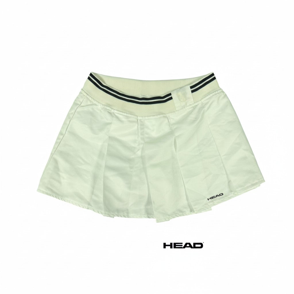 White pleated tennis skirt by HEAD with black stripe elastic waistband. Size M.
