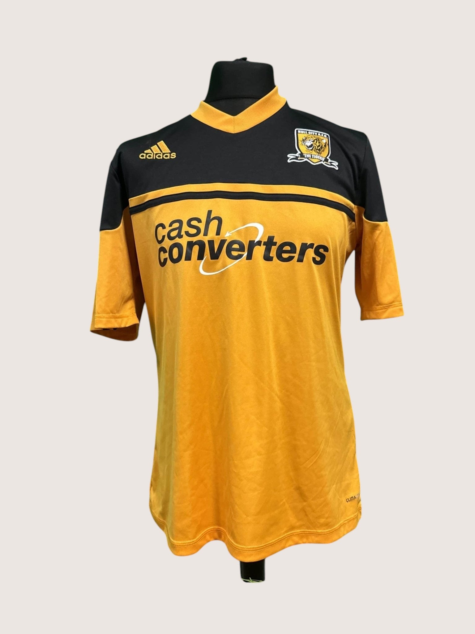 kitround Hull City adidas football shirt in yellow and black with team crest and sponsor logo on a mannequin