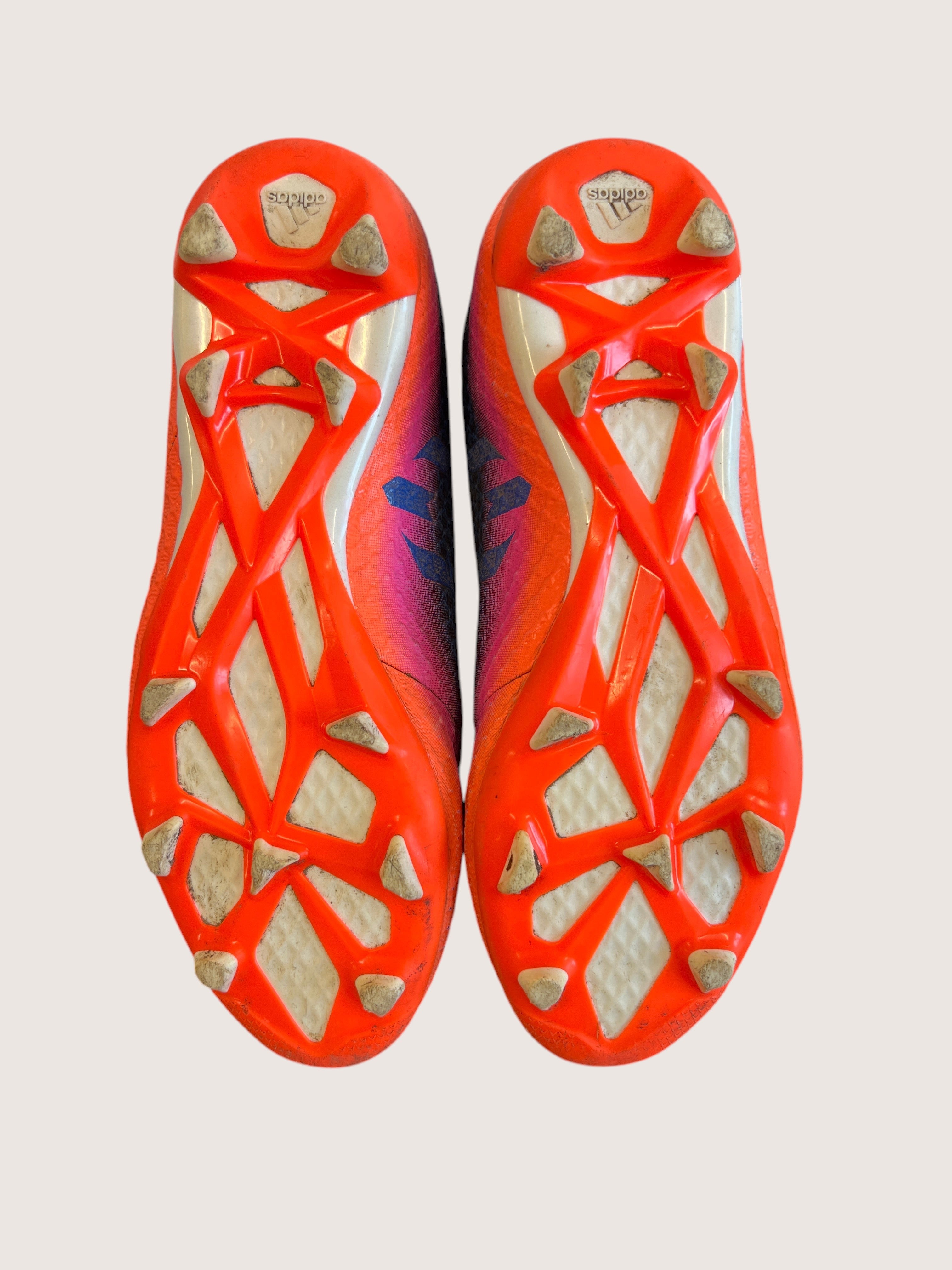 kitround kids adidas football boots with vibrant blue and pink gradient, featuring moulded studs for firm ground.