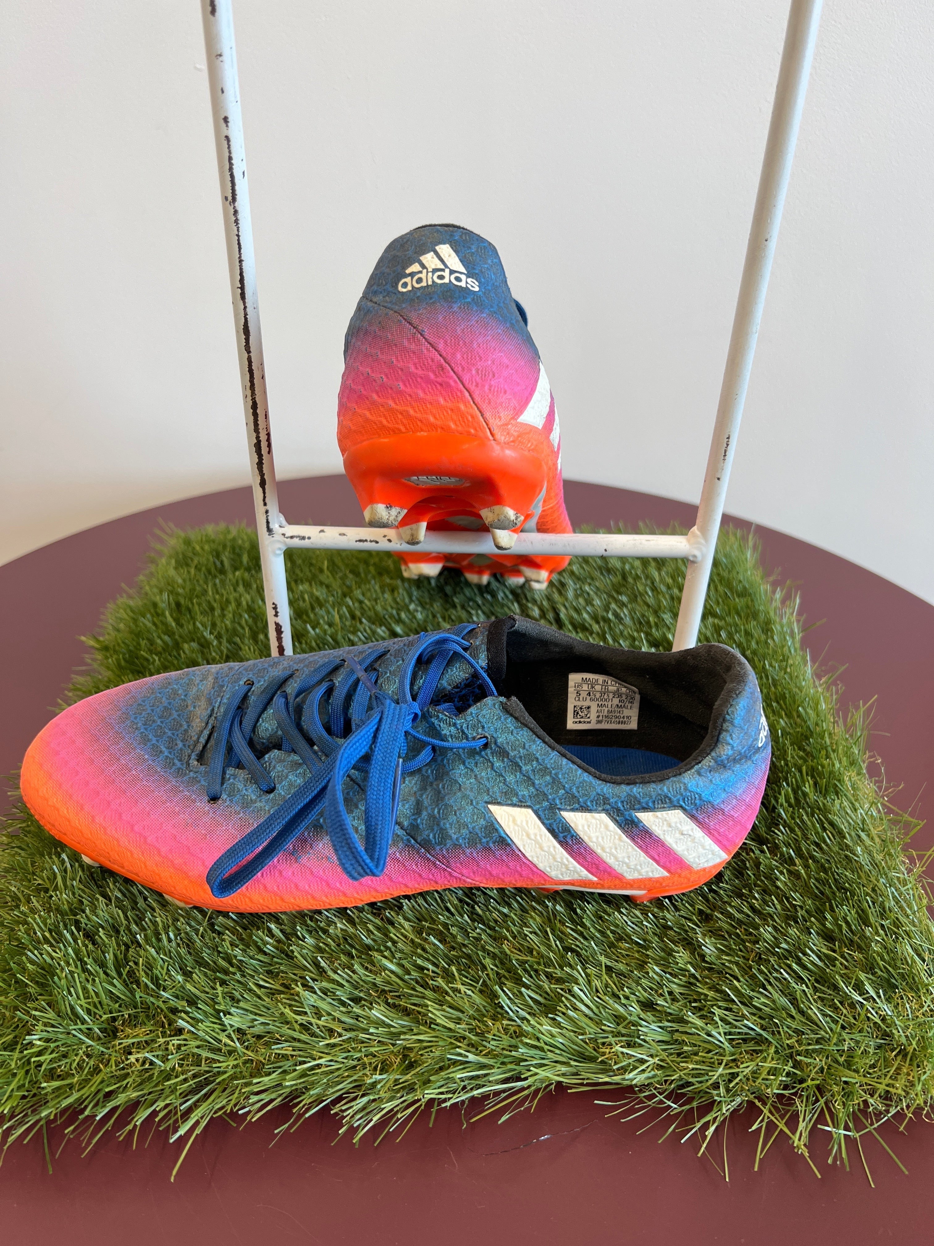 kitround kids adidas football boots in blue, pink, and orange gradient with textured synthetic upper and white stripes