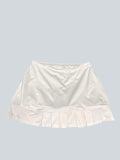 White KSwiss tennis skirt with pleated hem and breathable fabric for comfort and performance.