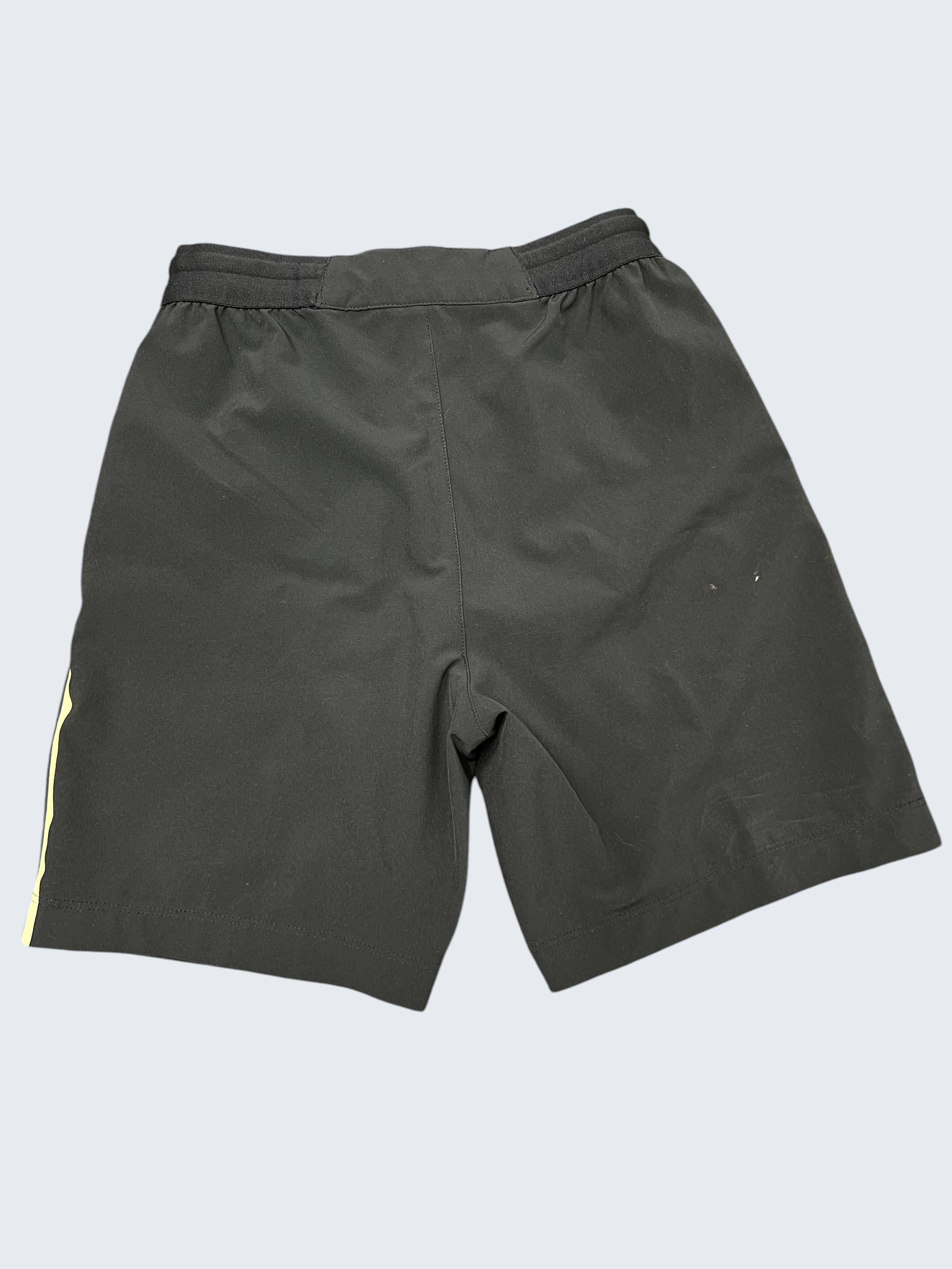 Kids Lacoste Roland Garros navy shorts age 8 with white side stripes and elastic waistband.