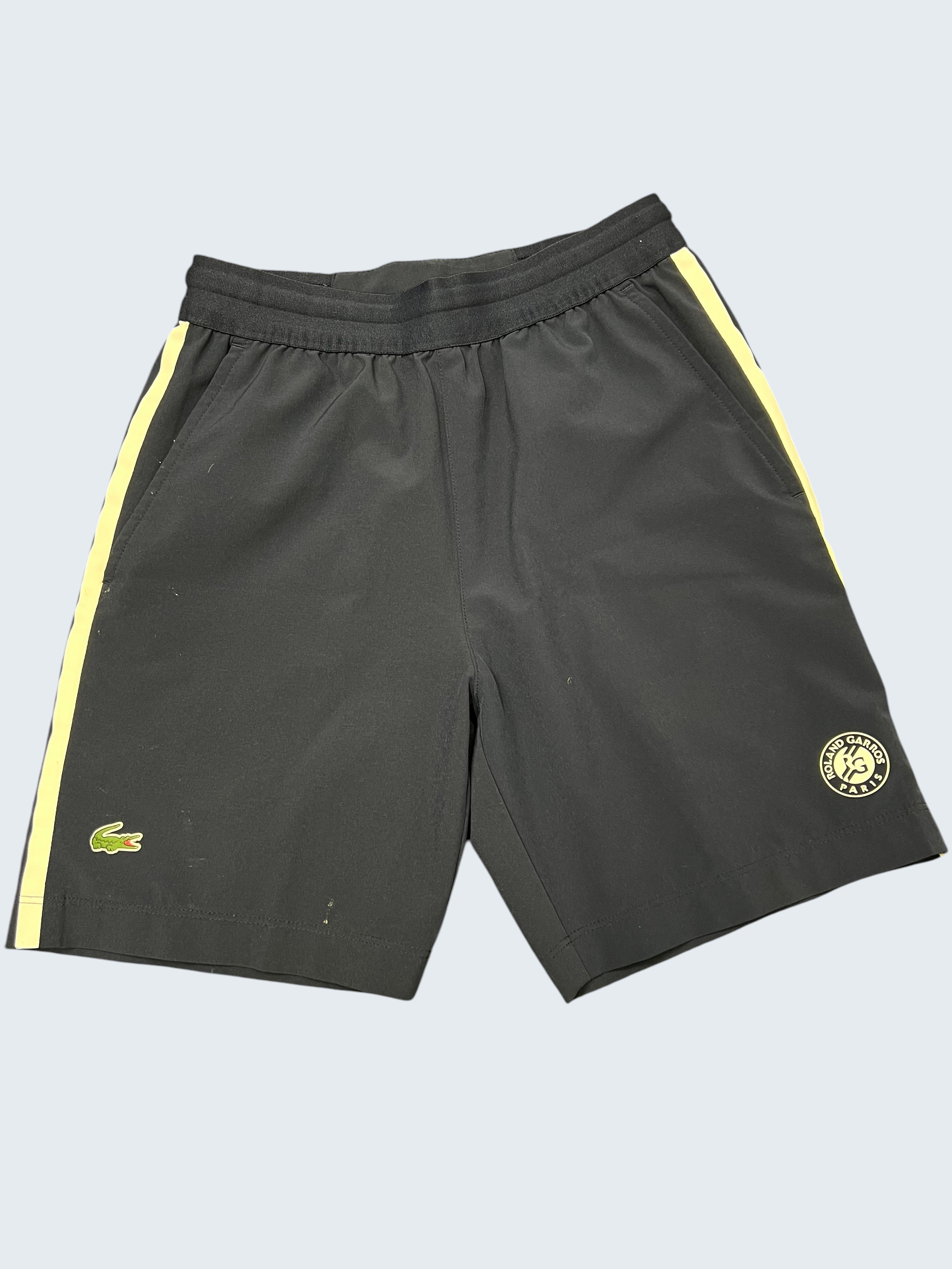 Kitround Kids Lacoste Roland Garros navy shorts with white side stripes, crocodile logo, and Roland Garros Paris emblem.