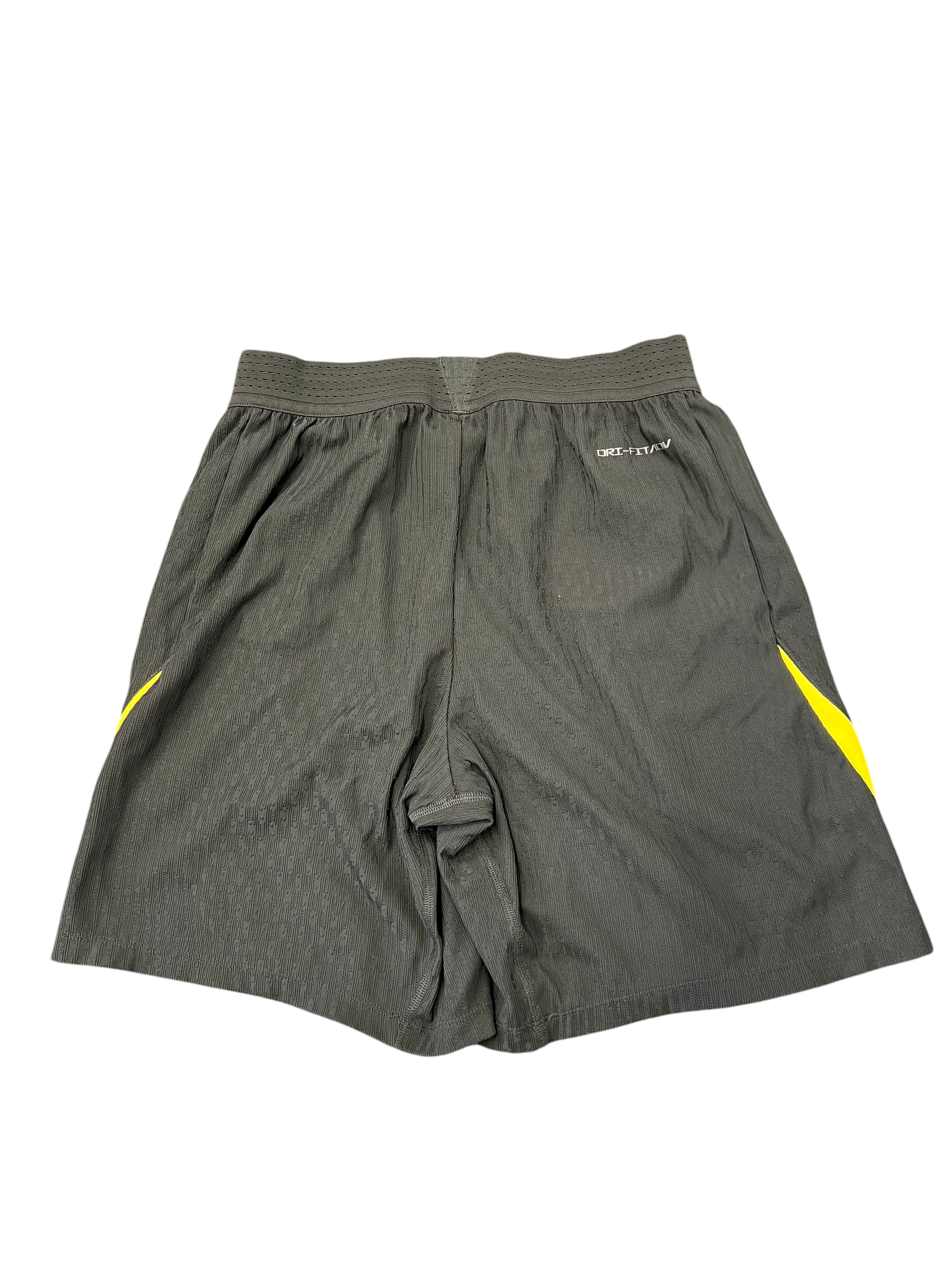 kitround dark grey Nike Dri Fit shorts with yellow Nike swoosh detail. Squad worn, size M.