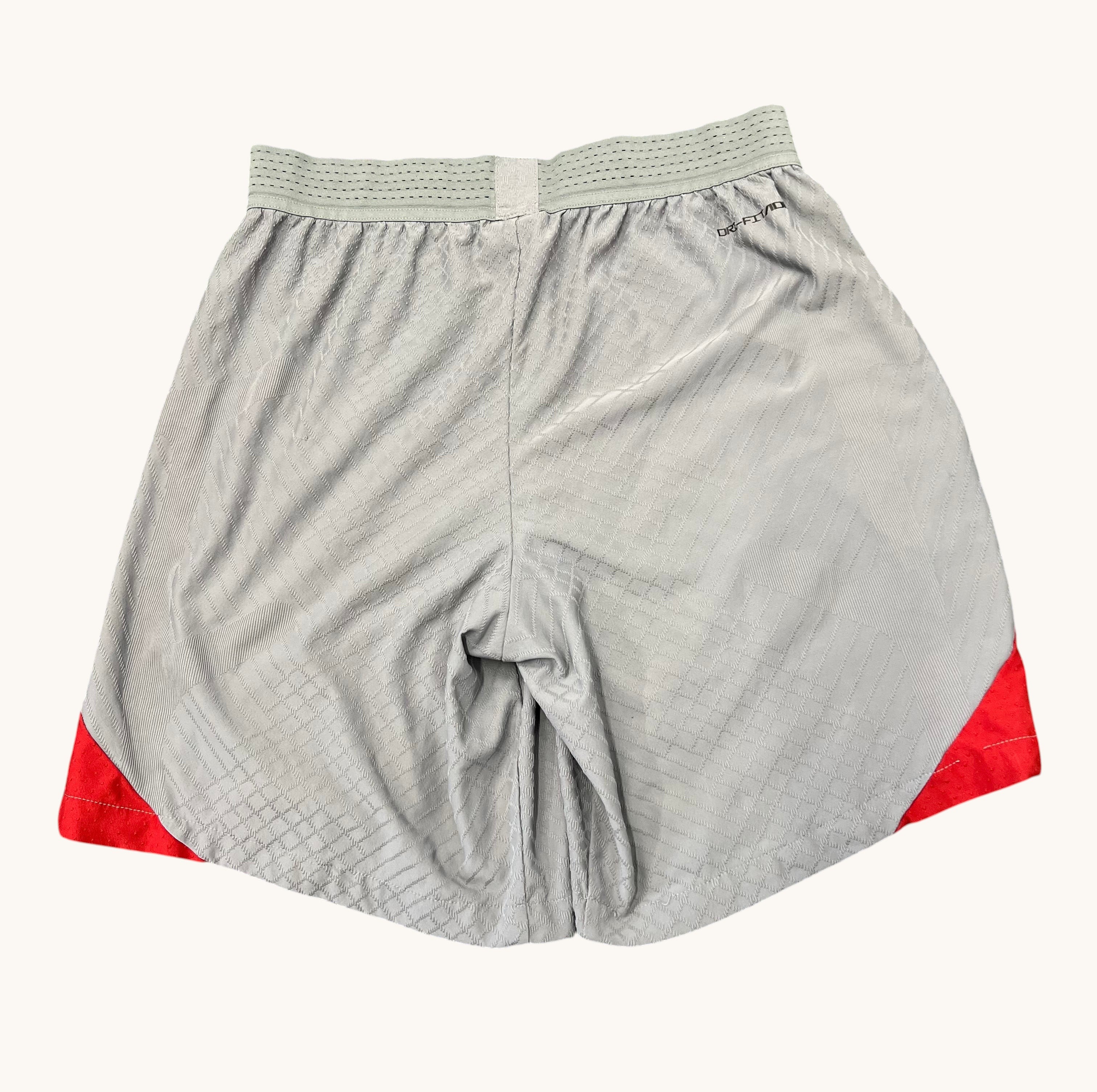 kitround Liverpool FC Nike Dri Fit shorts in light grey with red accents and a subtle diamond pattern. Squad worn.