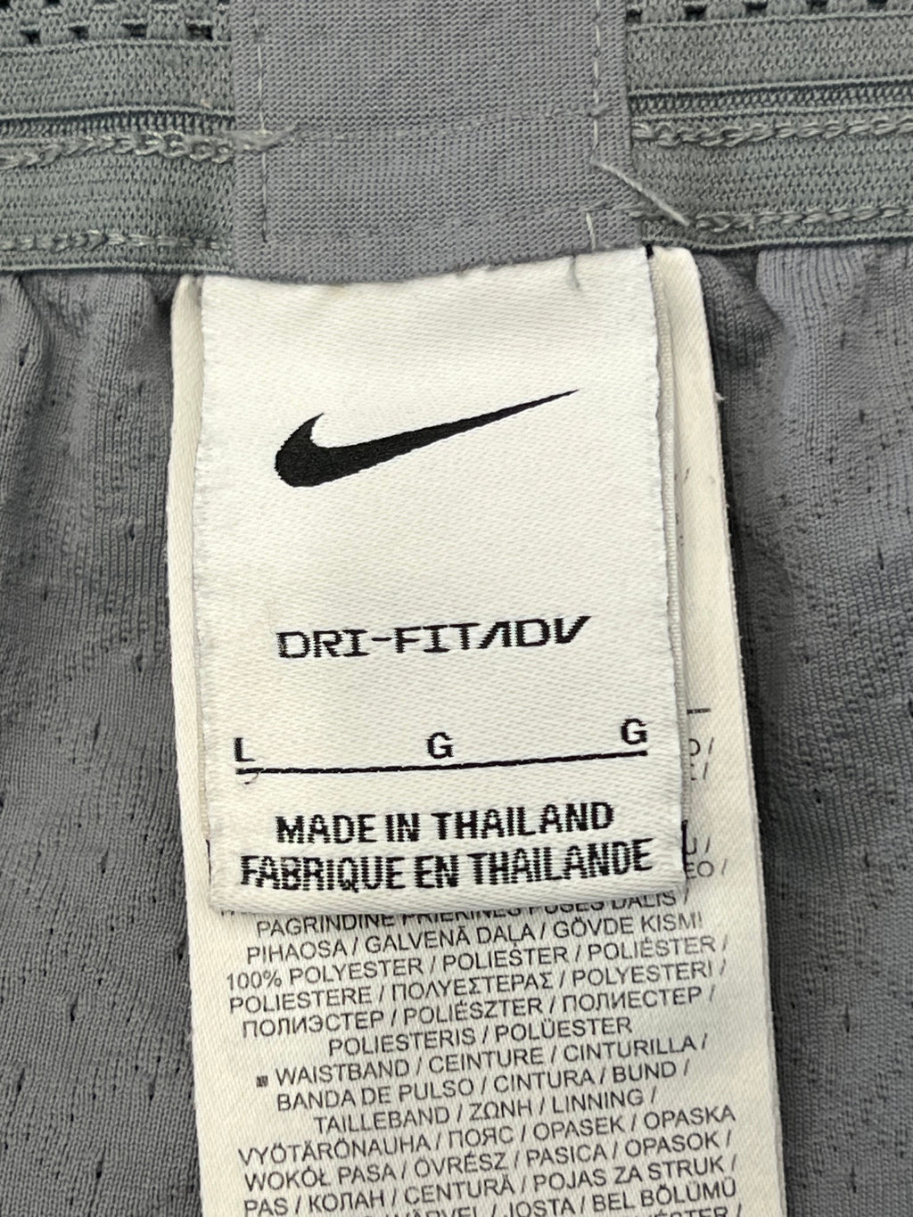 kitround Liverpool FC Nike Dri Fit shorts, light grey, size L, made in Thailand, squad worn with potential player initials or numbers.
