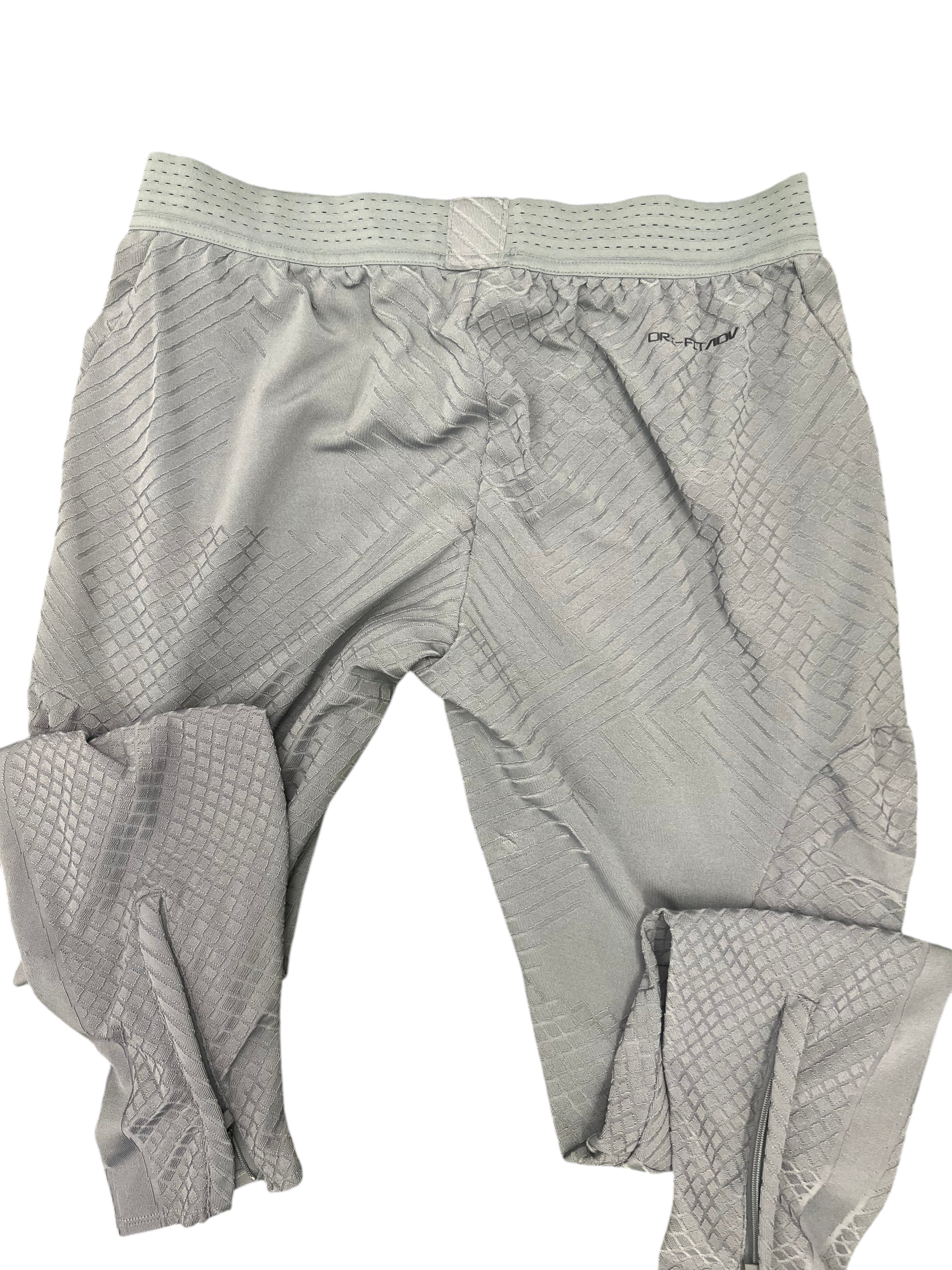 kitround Liverpool FC Men's grey training bottoms with textured pattern, Dri-FIT ADV, elasticated waist, and zipped ankles.