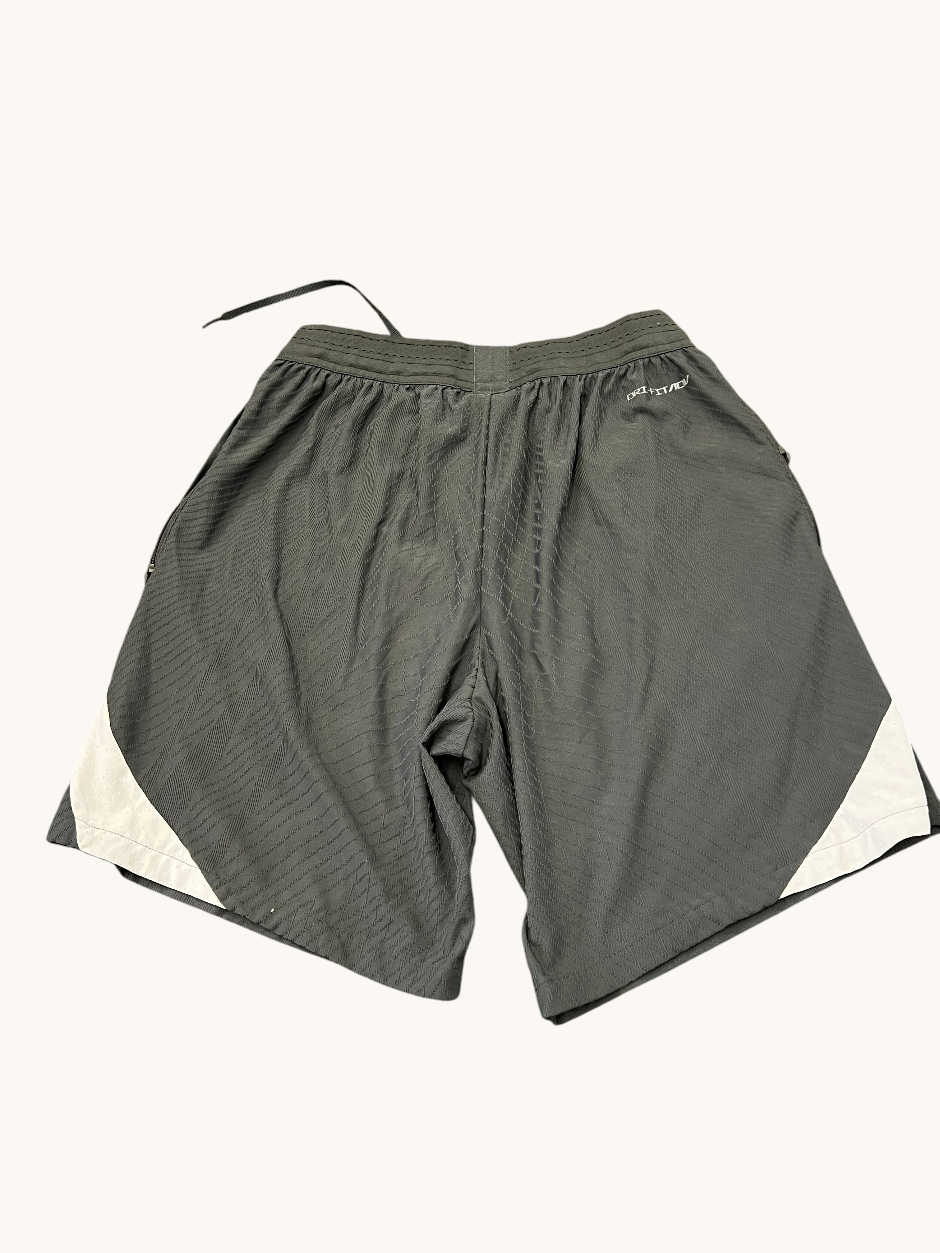 kitround Liverpool FC Nike Dri Fit shorts in dark grey with white accents. Squad worn, size L.