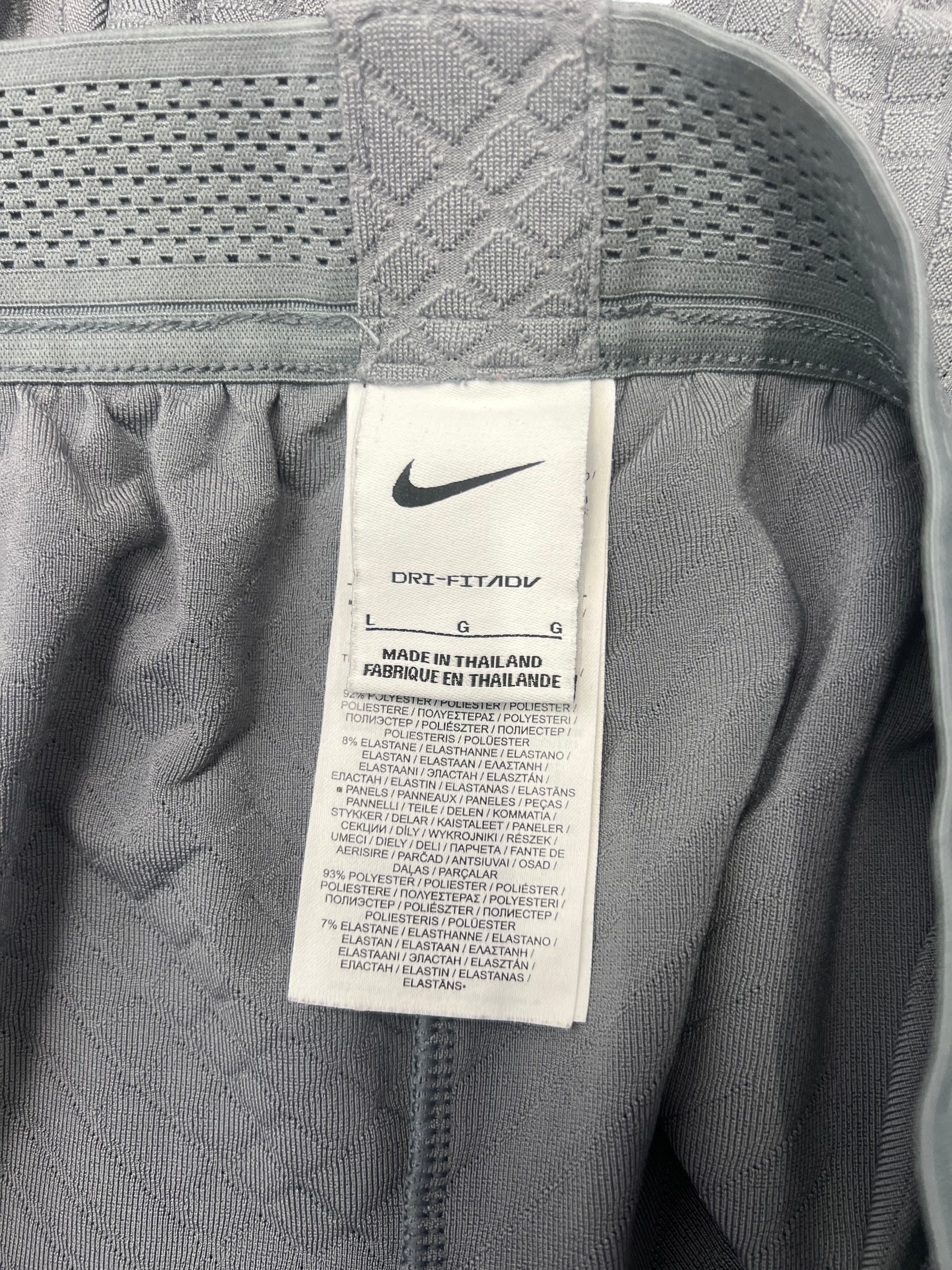 kitround Liverpool FC Men's grey polyester and elastane training bottoms with Nike Dri-FIT ADV technology.