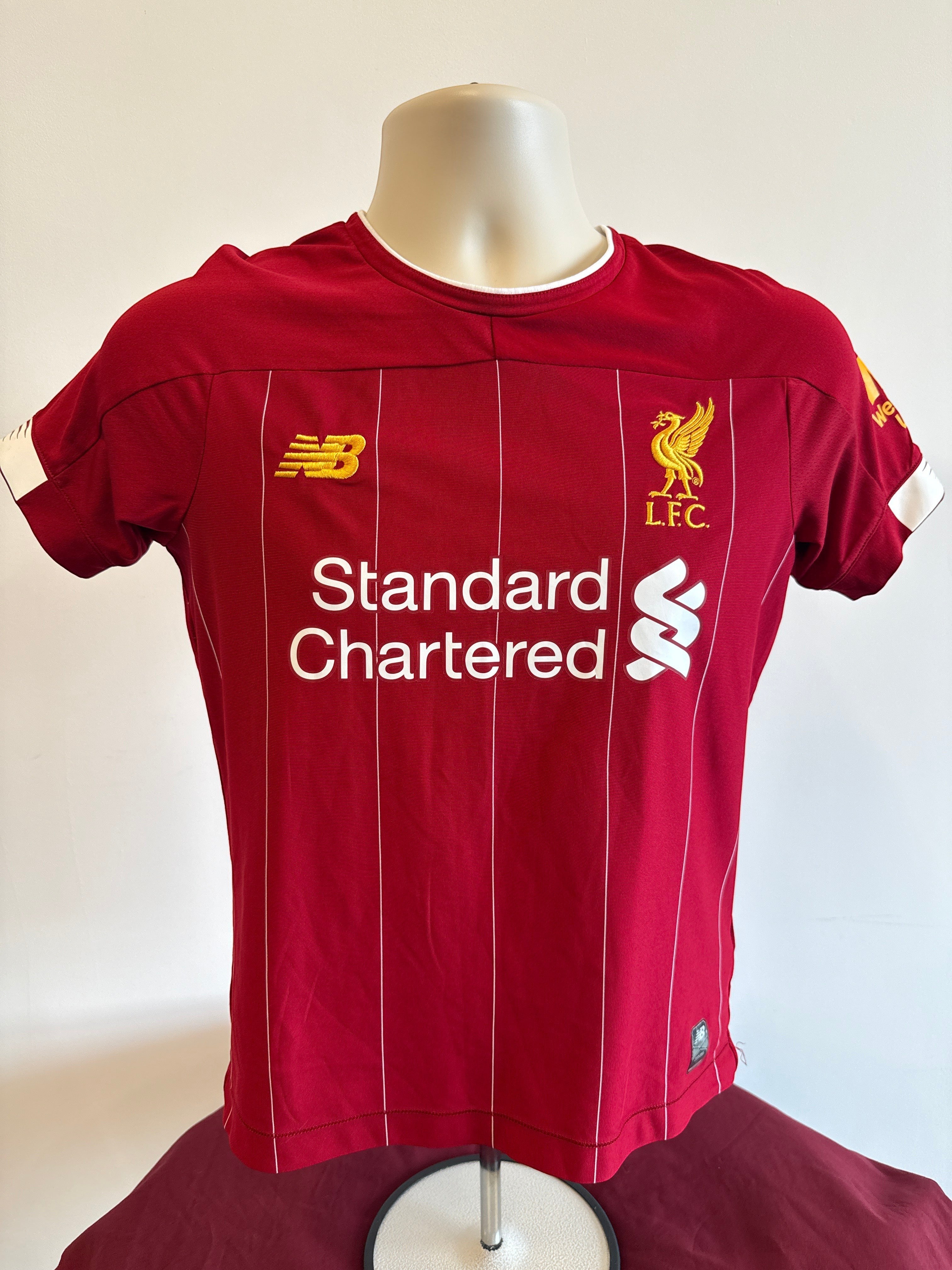 kitround Liverpool home football shirt in red with white pinstripes, New Balance logo, and club crest.