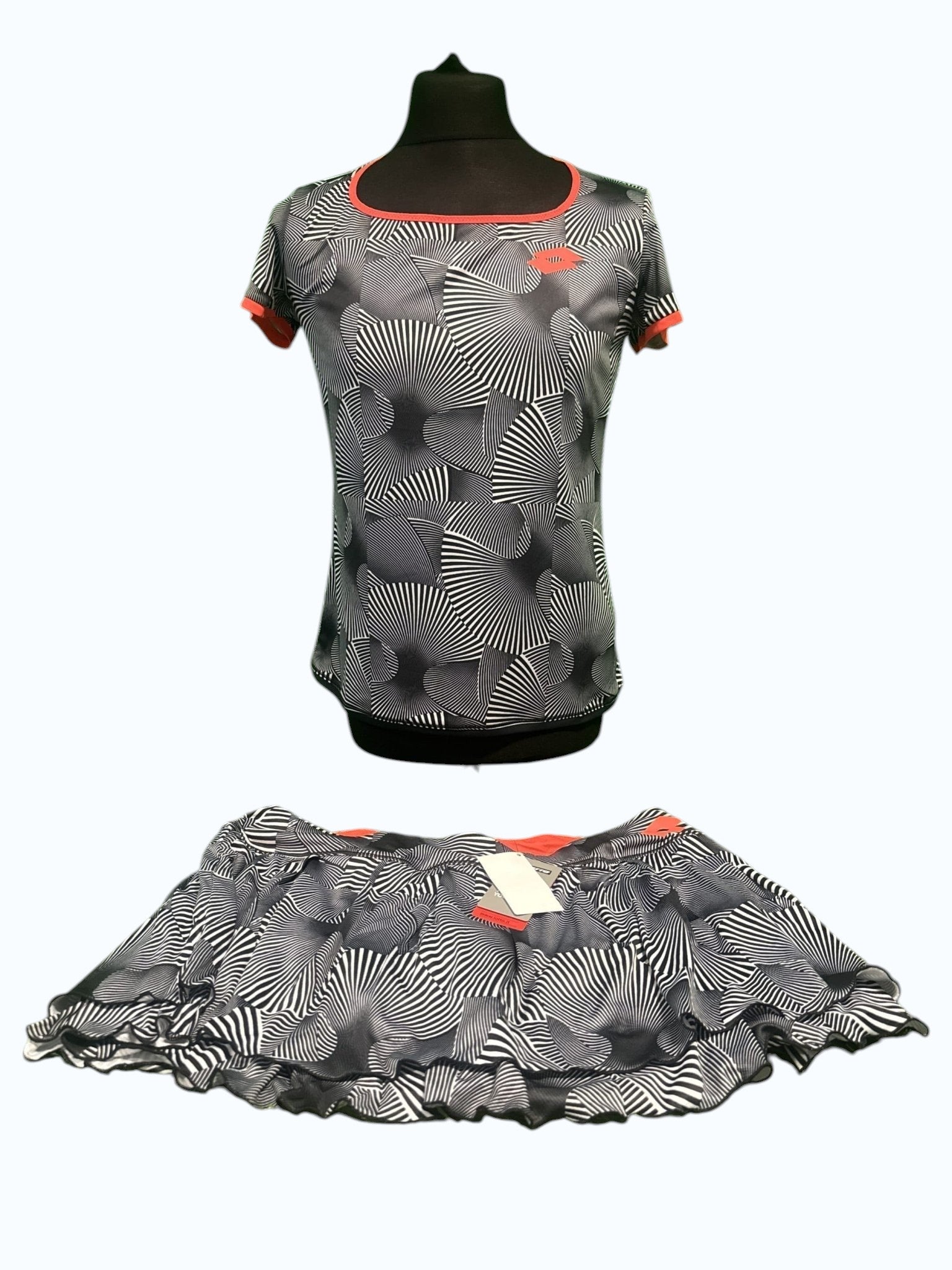 kitround Lotto women's black and white geometric print tennis top and skirt set with red trim.